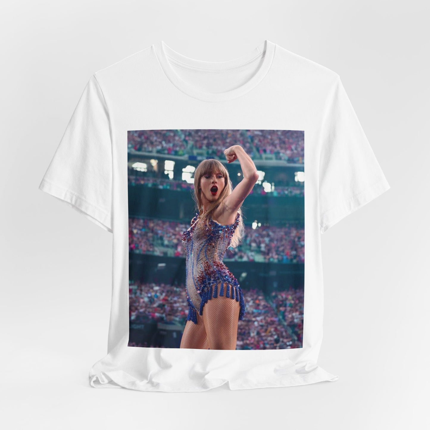 A black graphic t-shirt featuring a graphic or photo of Taylor Swift performing live on stage.