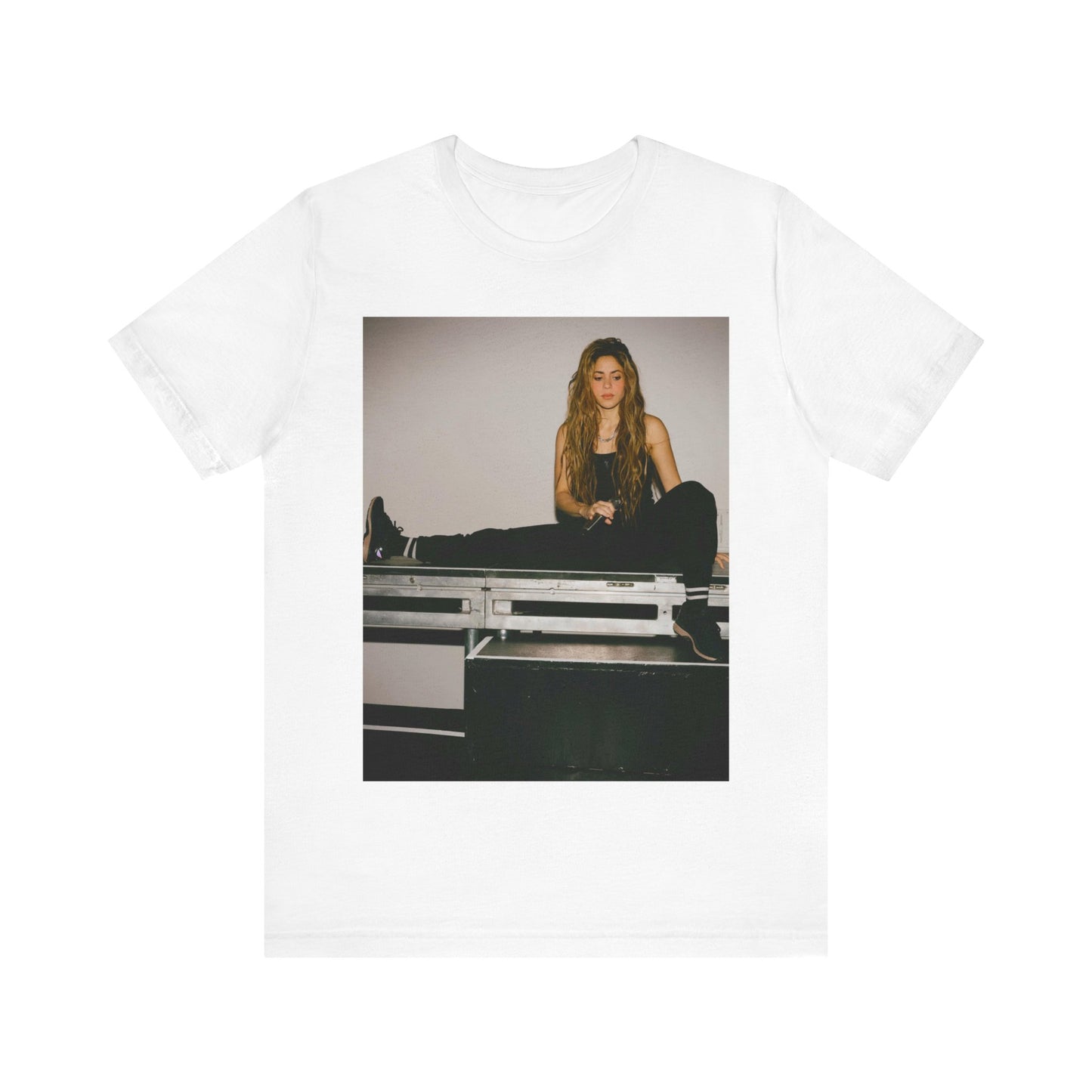 A black graphic t-shirt featuring a modern pop essential graphic of Shakira.