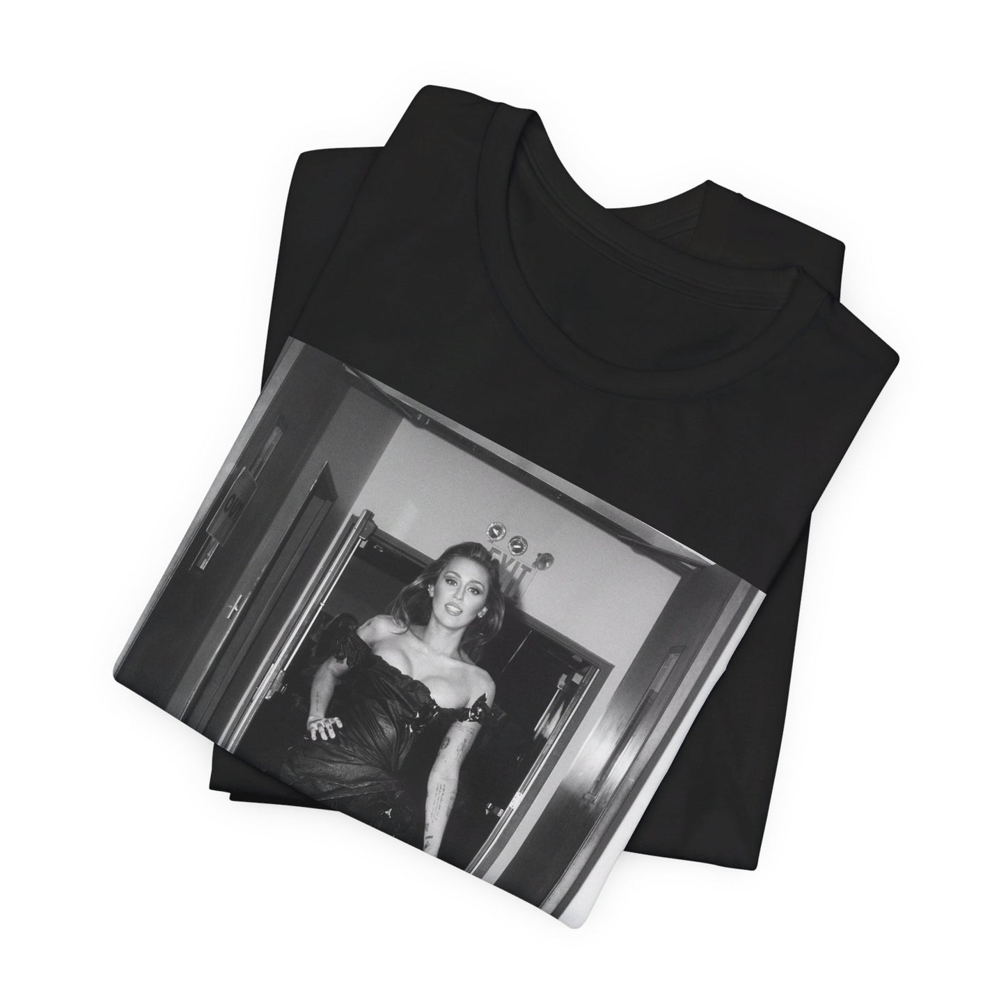 A black graphic t-shirt featuring a black and white graphic of Miley Cyrus in a cool pop rock style.
