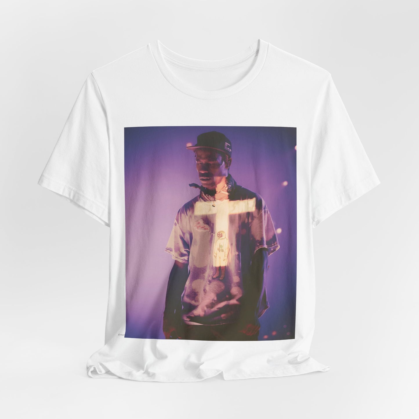A black graphic t-shirt featuring a graphic of Travis Scott with dark fantasy vibes.