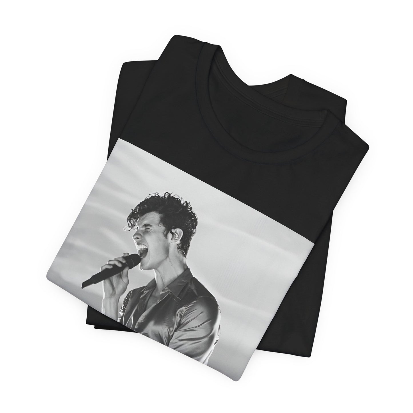 A black graphic t-shirt featuring a black and white graphic or photo of Shawn Mendes as a dreamy pop star.