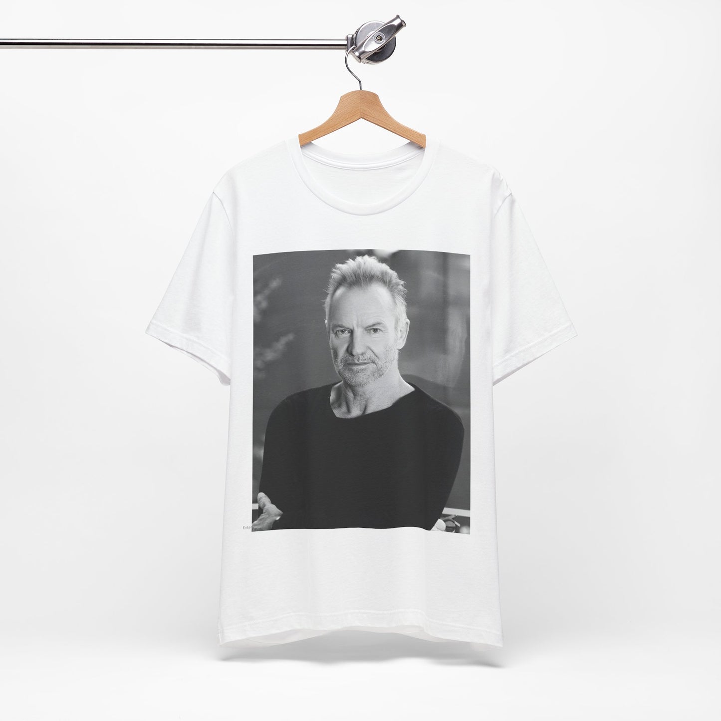 A black graphic t-shirt featuring a vintage graphic related to Sting's 'Desert Rose' song or era.