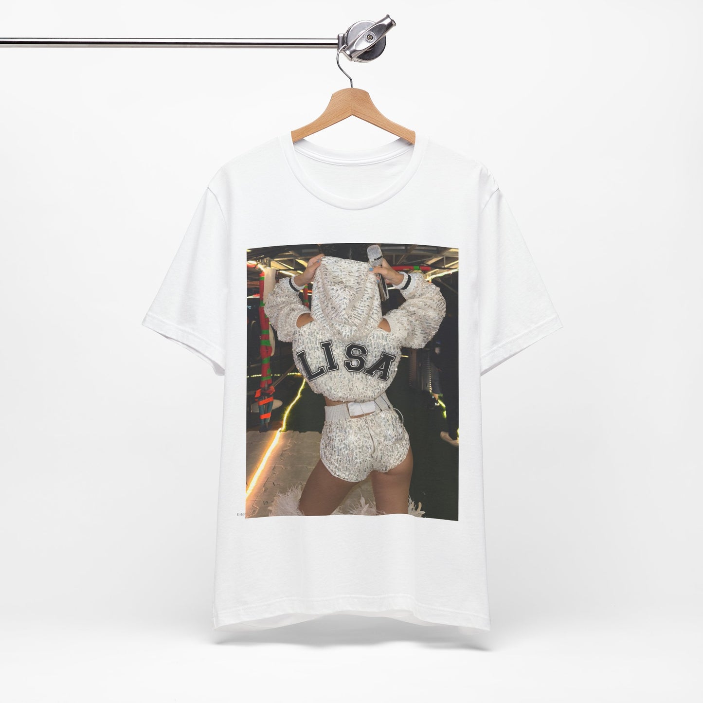 A black graphic t-shirt featuring a graphic or photo of Lisa in a backstage setting.