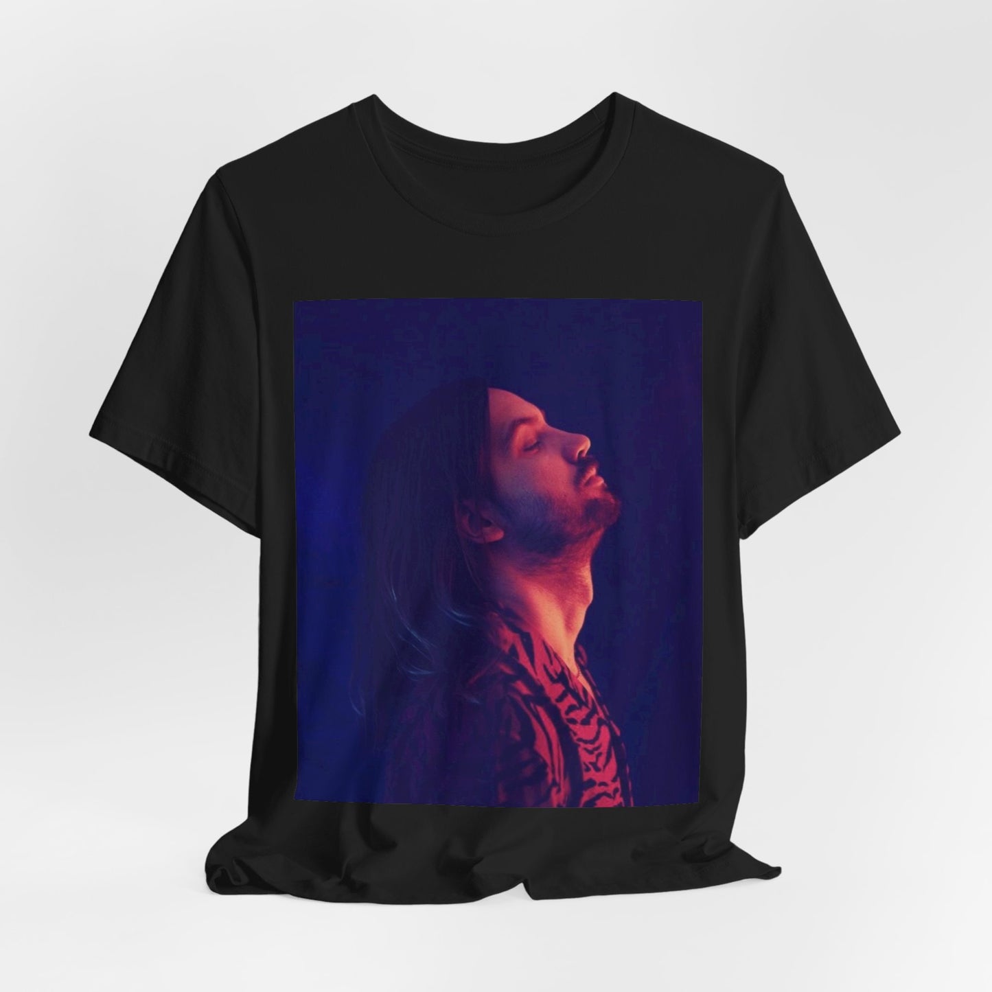 A black graphic t-shirt featuring a retro indie alt-rock graphic of Tame Impala.