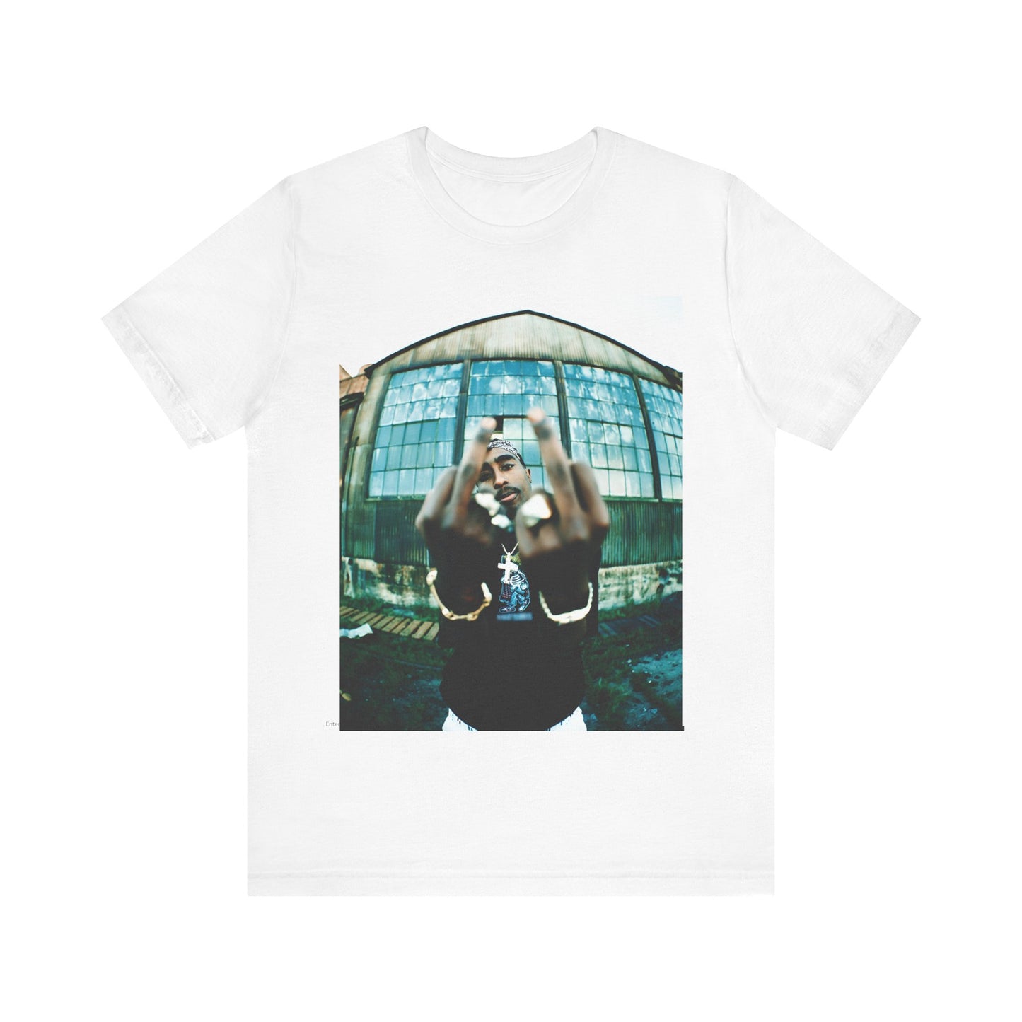 A black graphic t-shirt featuring a graphic of Tupac giving the middle finger.