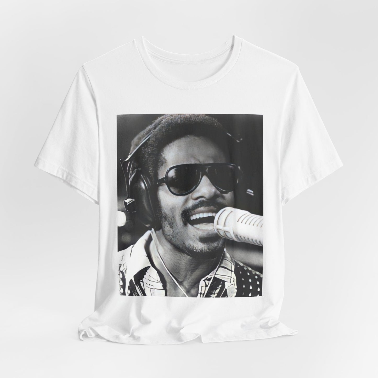 A black graphic t-shirt featuring a graphic of Stevie Wonder as a timeless visionary.
