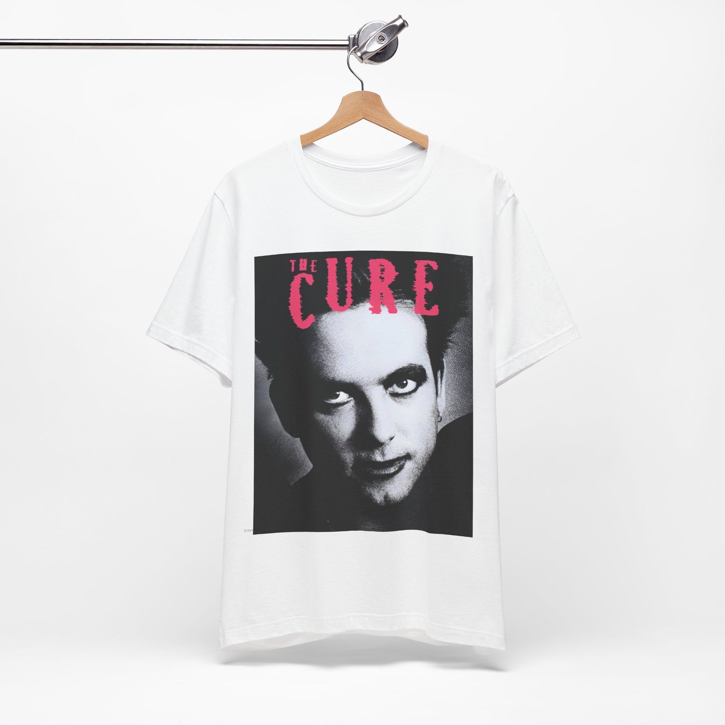 A black graphic t-shirt featuring an 80s post-punk aesthetic graphic of The Cure.