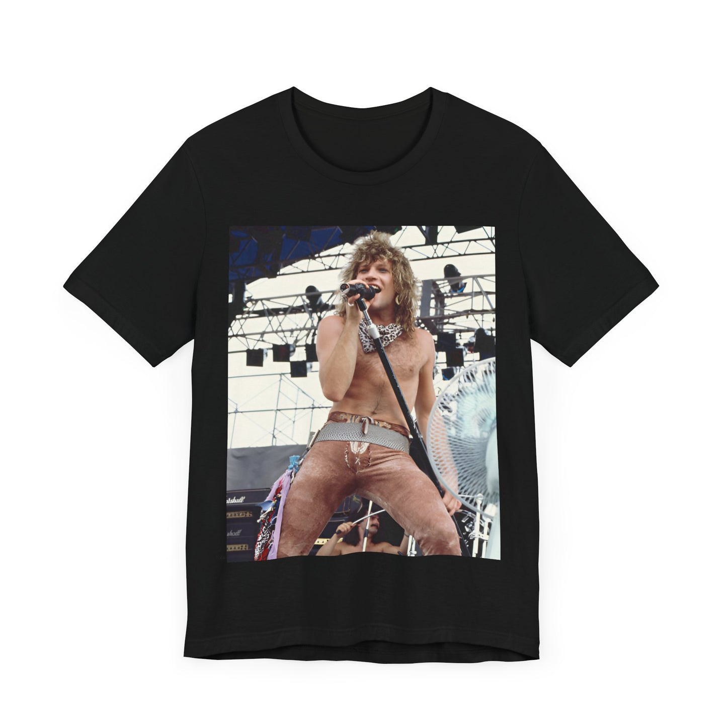 A black graphic t-shirt featuring a dynamic graphic or photo of Bon Jovi performing live on stage with a fierce intensity.
