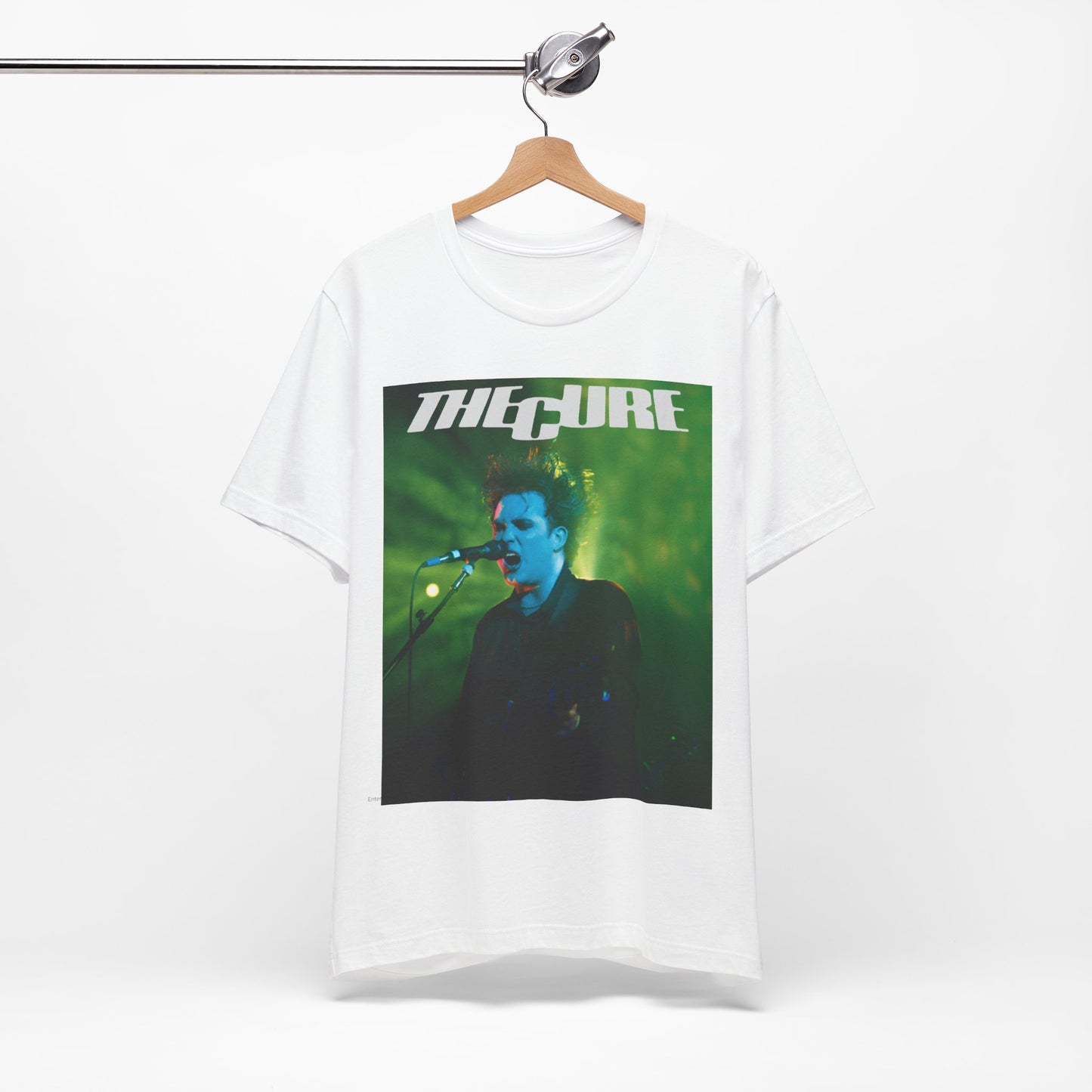A black graphic t-shirt featuring a graphic or photo of The Cure performing live on stage.
