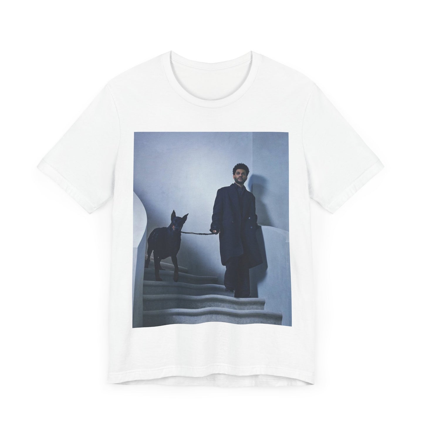 A black graphic t-shirt featuring a photo of The Weeknd with a doberman.