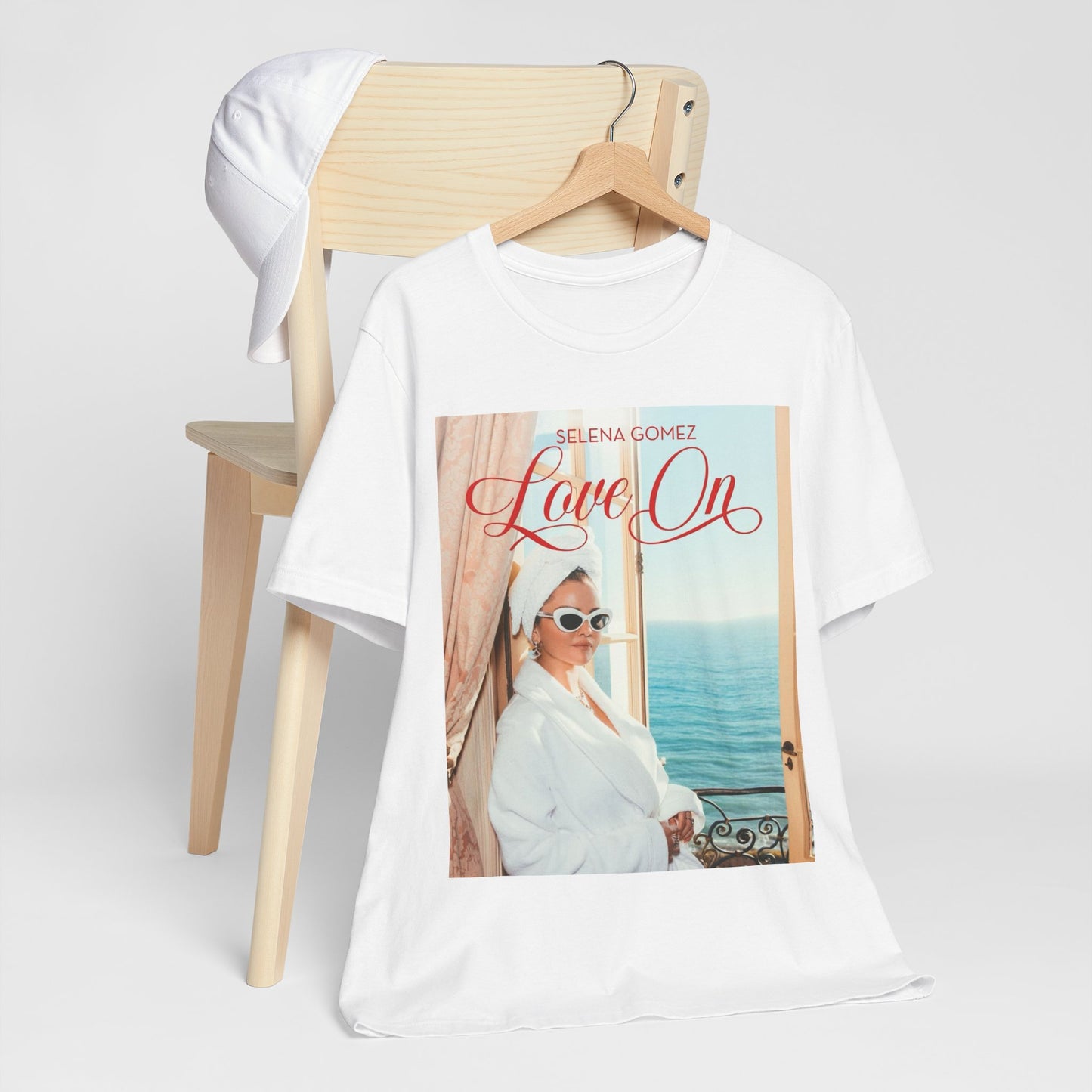 A black graphic t-shirt featuring a graphic related to Selena Gomez's 'Love On' song.