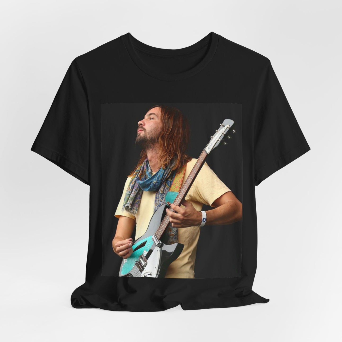 A black graphic t-shirt featuring a vintage indie rock graphic of Tame Impala.