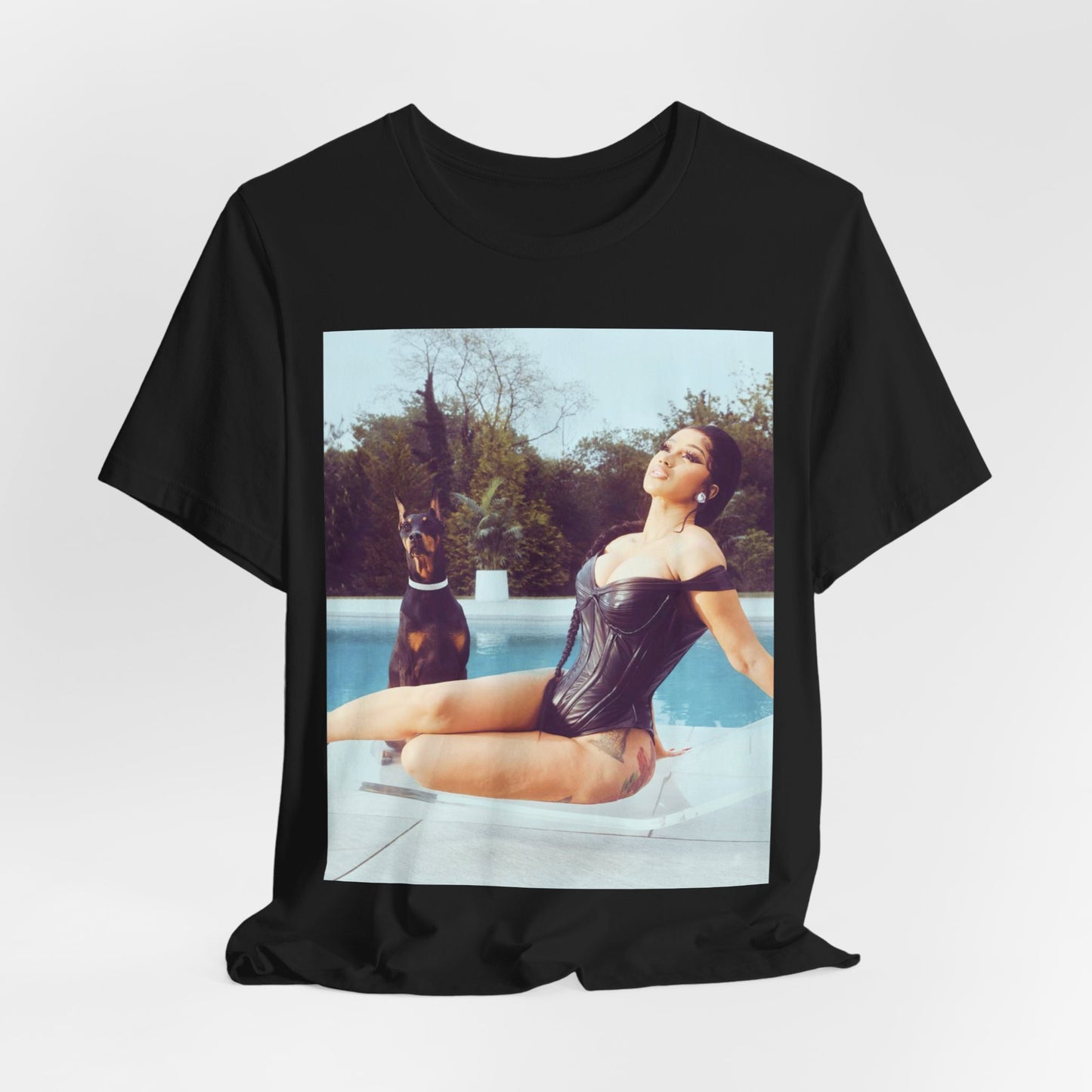 A black graphic t-shirt featuring a graphic related to Cardi B's 'I Like It' song, with bold pop culture elements.