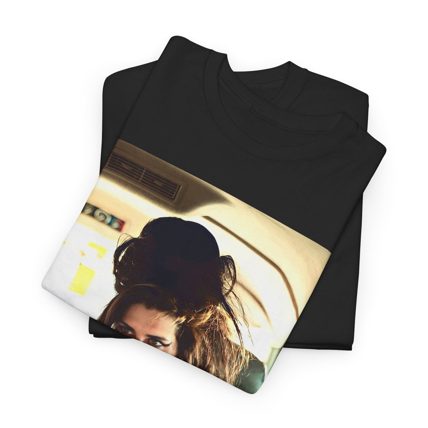 A black graphic t-shirt featuring a chaotic or candid graphic of Amy Winehouse offstage, capturing her intense or expressive moments.