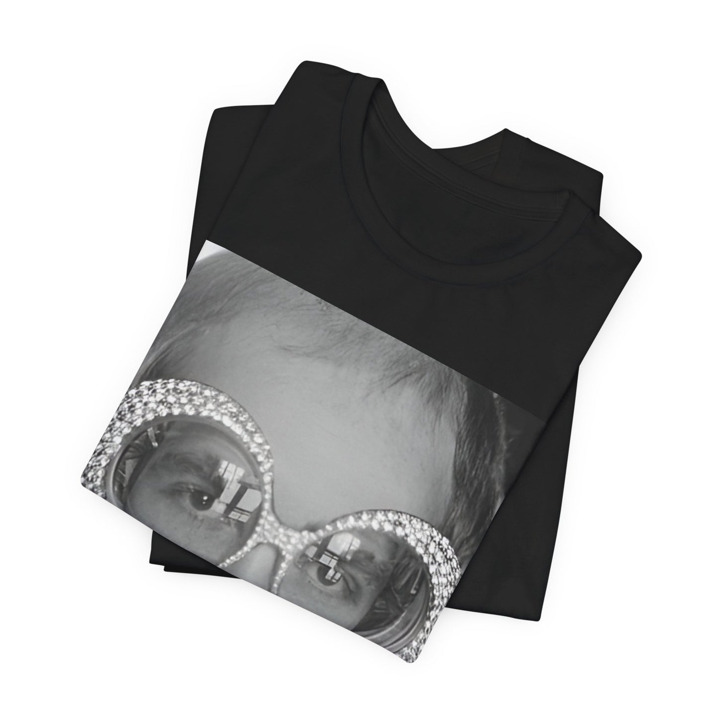 A black graphic t-shirt featuring a graphic of Elton John emphasizing his iconic glasses and fashion.