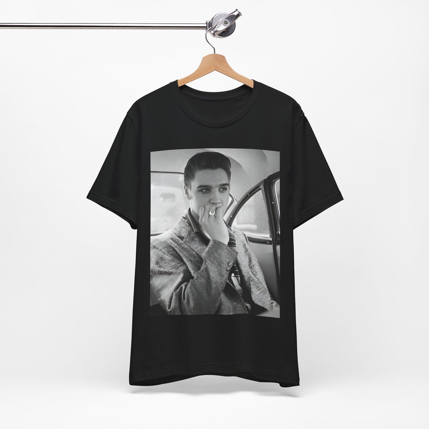 A black graphic t-shirt featuring a classic 50s era graphic of Elvis Presley.