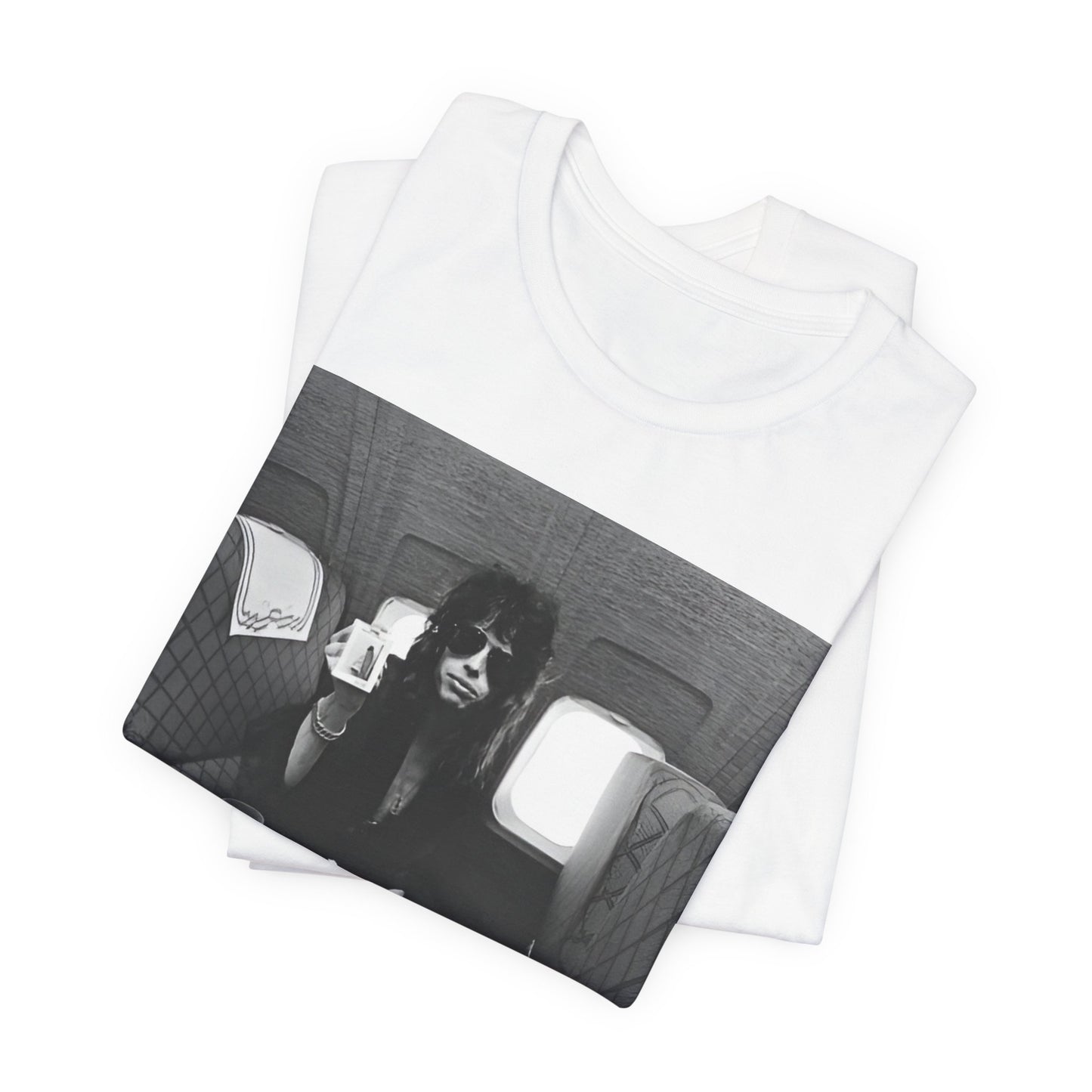 A black graphic t-shirt featuring a vintage 70s-style illustration of an airplane with Aerosmith branding, representing their tour plane from that era.