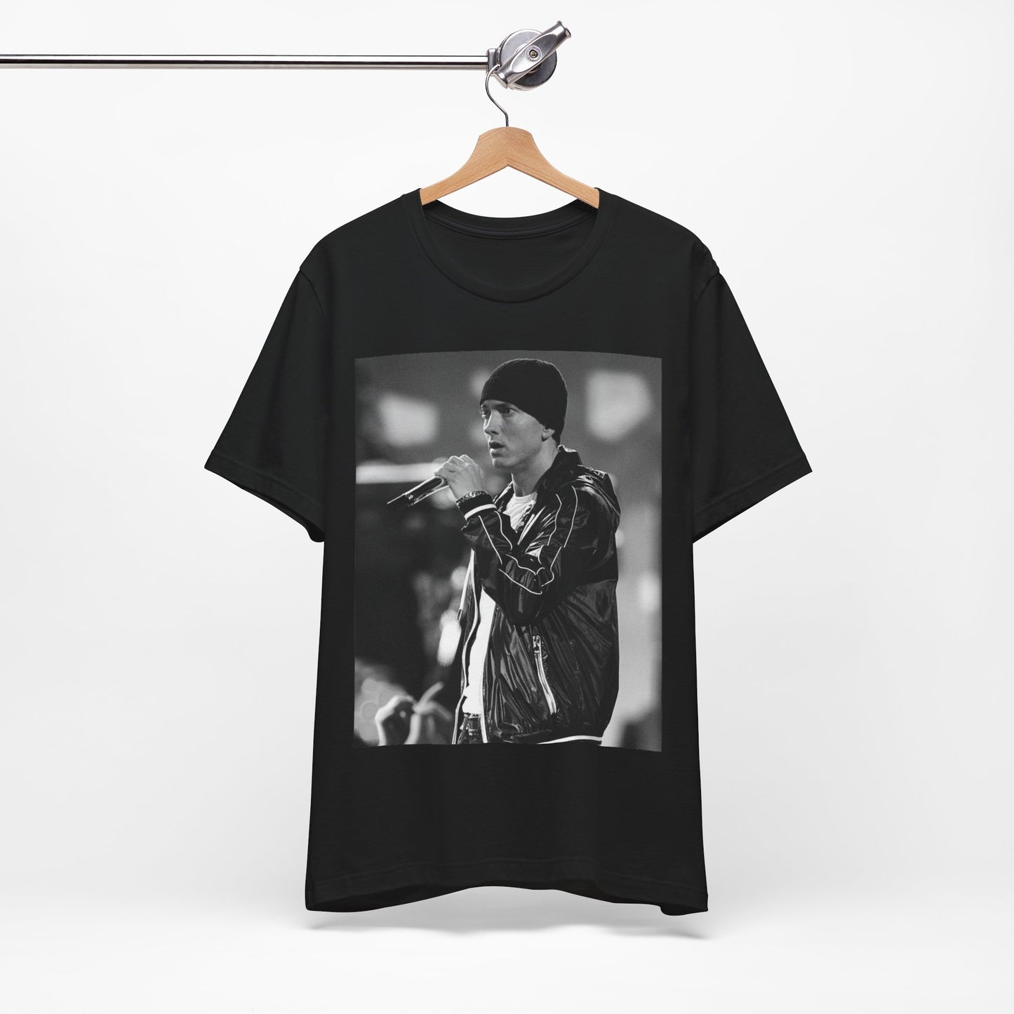 A black graphic t-shirt featuring a classic 90s graphic of Eminem as a 'Rap God'.