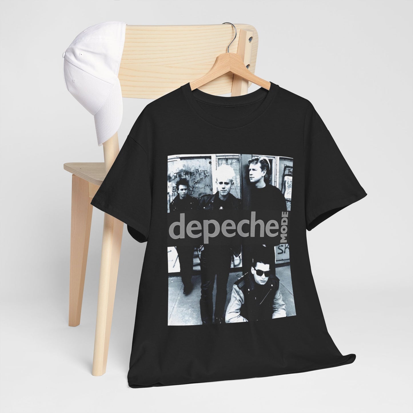 A black graphic t-shirt featuring a black and white photo portrait of the band Depeche Mode.