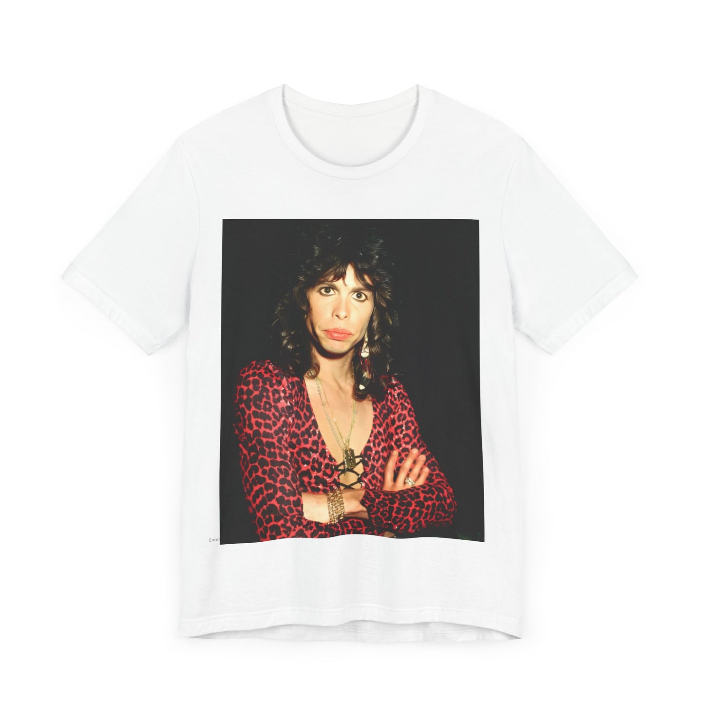A black graphic t-shirt featuring a vintage 70s-inspired design with Aerosmith branding, incorporating a prominent leopard print pattern.