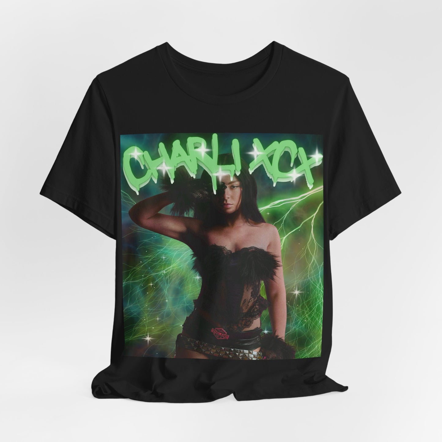 A black graphic t-shirt featuring a retro green neon graphic of Charli XCX's signature.