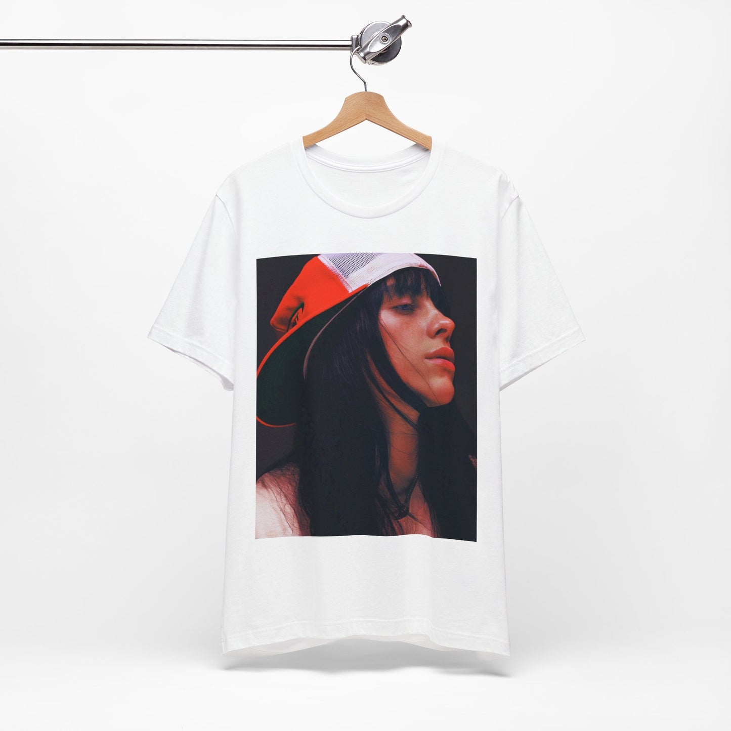 A graphic t-shirt featuring the name 'Billie Eilish' in a raw, urban street-style font.