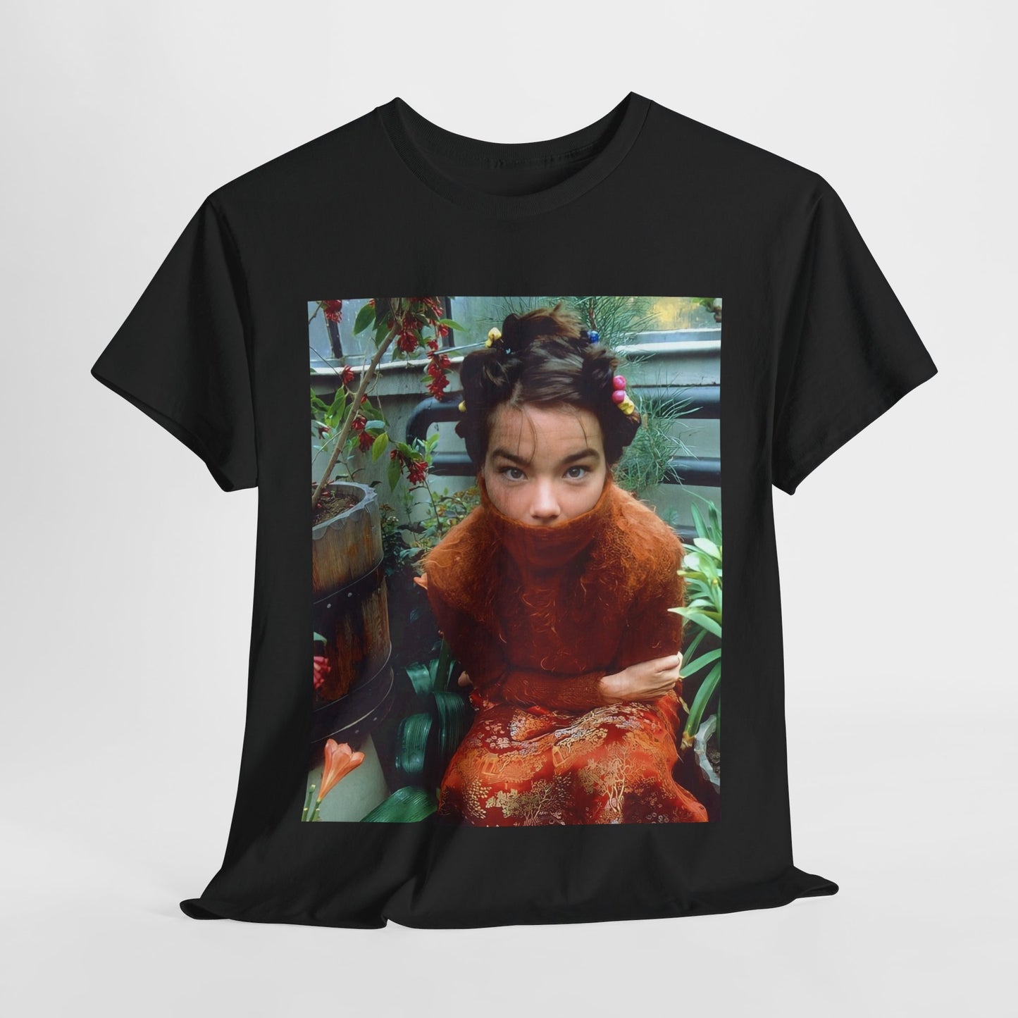 A black graphic t-shirt featuring a dynamic and 'fierce' graphic of Bjork, emphasizing her strong and confident presence.