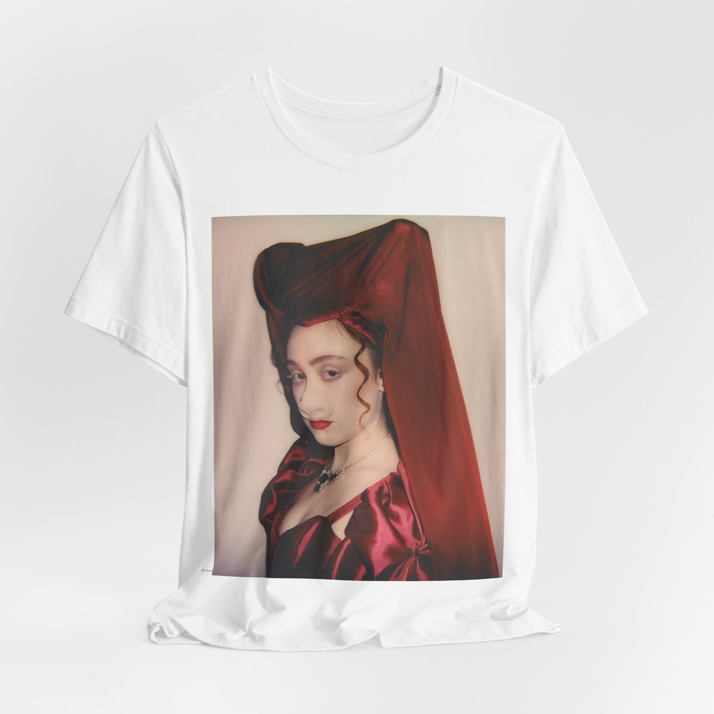 A black graphic t-shirt featuring a vintage-style graphic of Chappell Roan as a pop star.