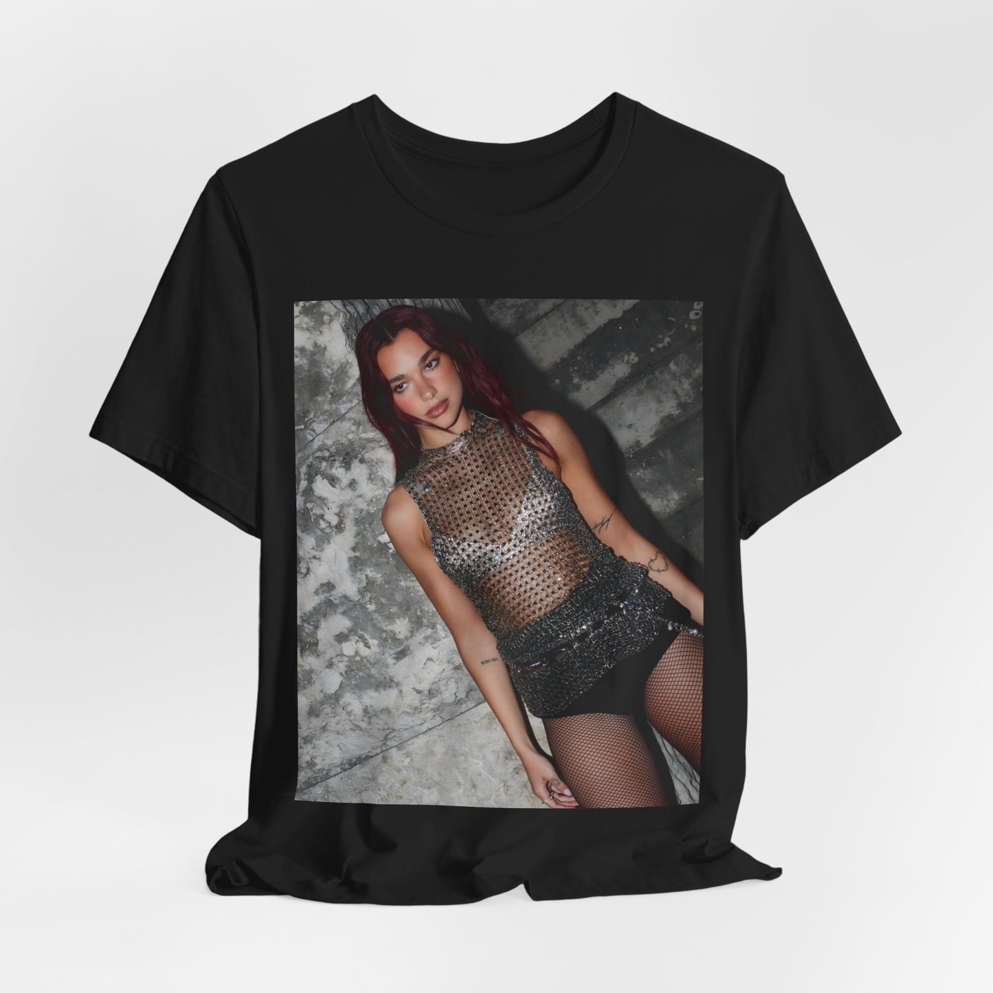 A black graphic t-shirt featuring a graphic of Dua Lipa as a disco queen, with an aesthetic design.