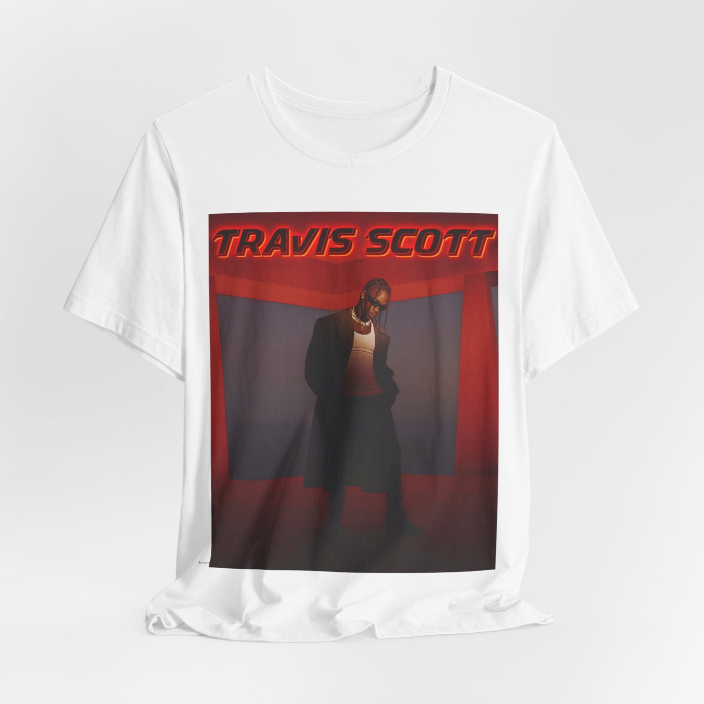 A black graphic t-shirt featuring a graphic of Travis Scott with a dreamy rap soundscape aesthetic.