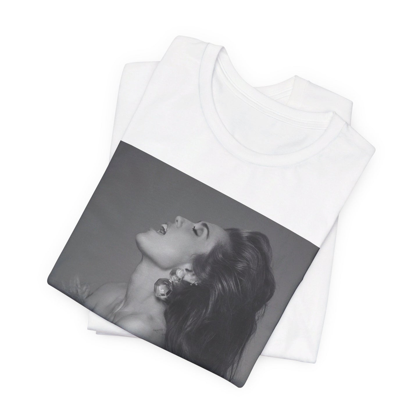 A black graphic t-shirt featuring a black and white portrait photo of Miley Cyrus.