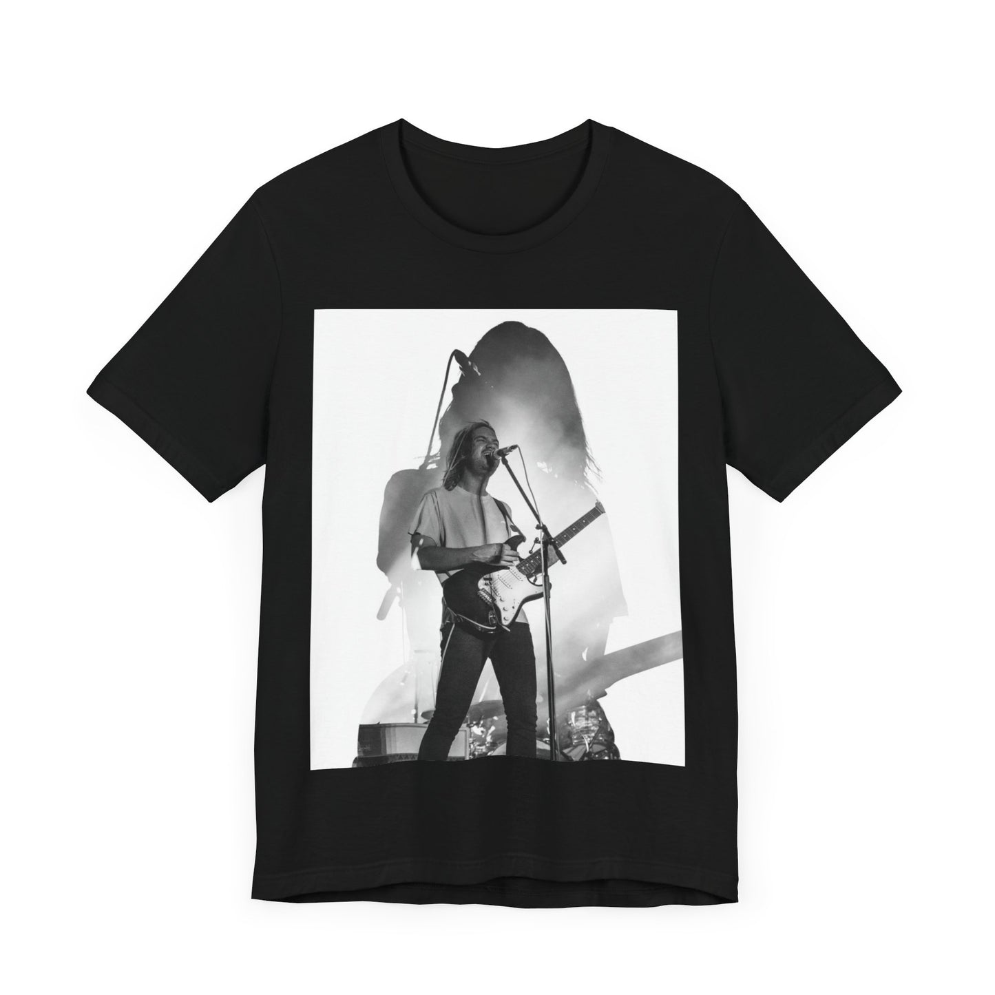 A black graphic t-shirt featuring a black and white, monochrome graphic or photo of Tame Impala.