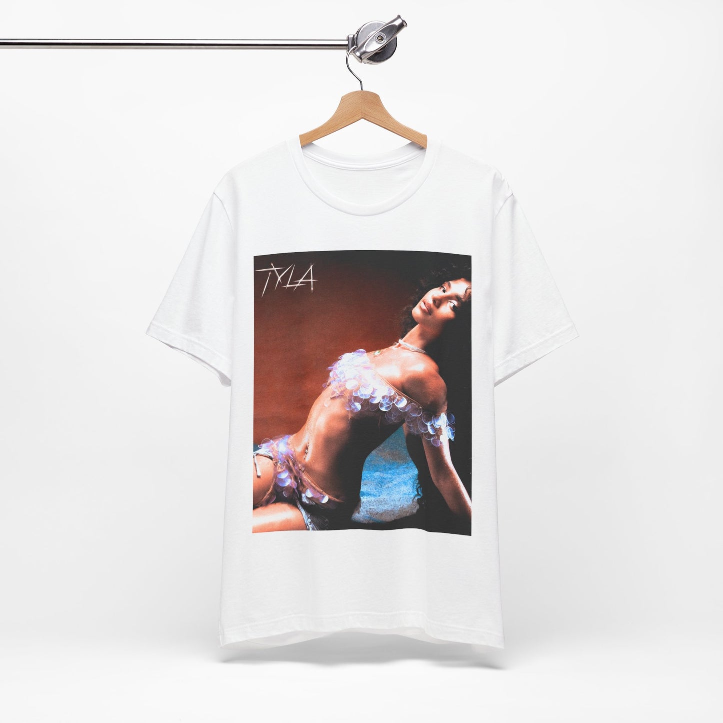 A black graphic t-shirt featuring a cultural fusion vibes graphic of Tyla.