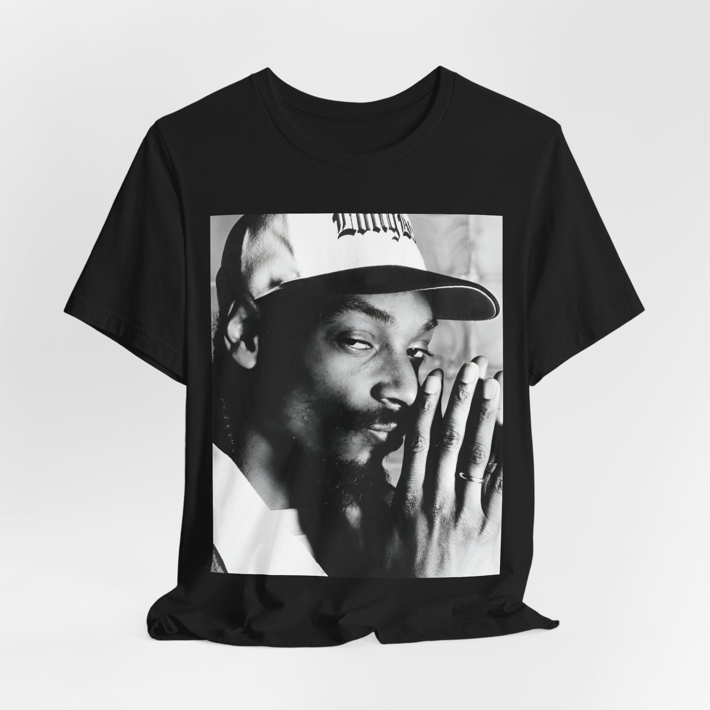 A black graphic t-shirt featuring a cool black and white graphic or photo of Snoop Dogg as a rapper.