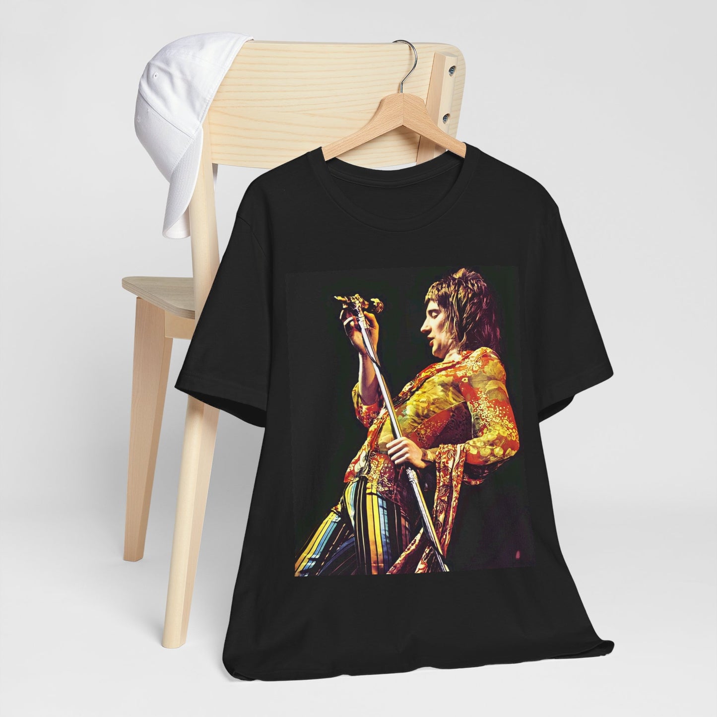A black graphic t-shirt featuring a retro 70s graphic or photo of Rod Stewart performing live on stage.