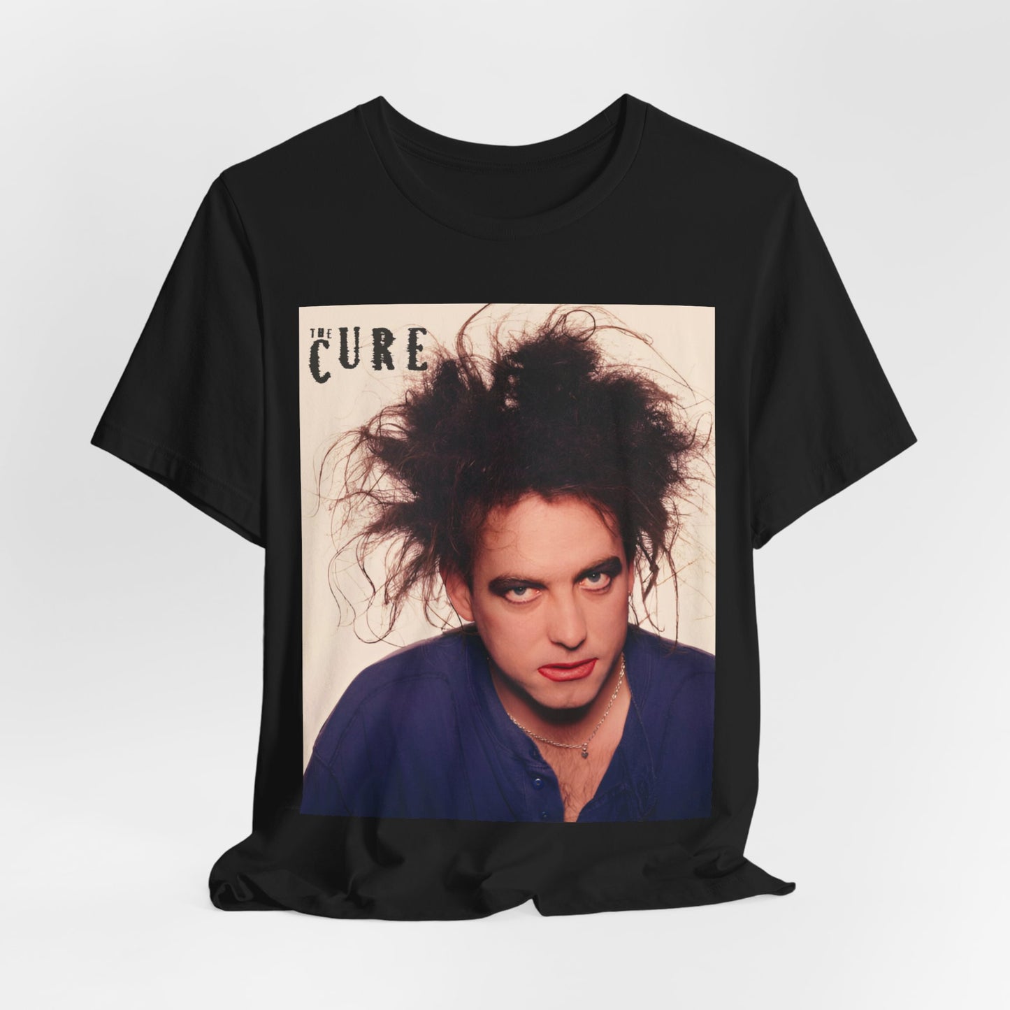 A black graphic t-shirt featuring a photo portrait of Robert Smith from The Cure.