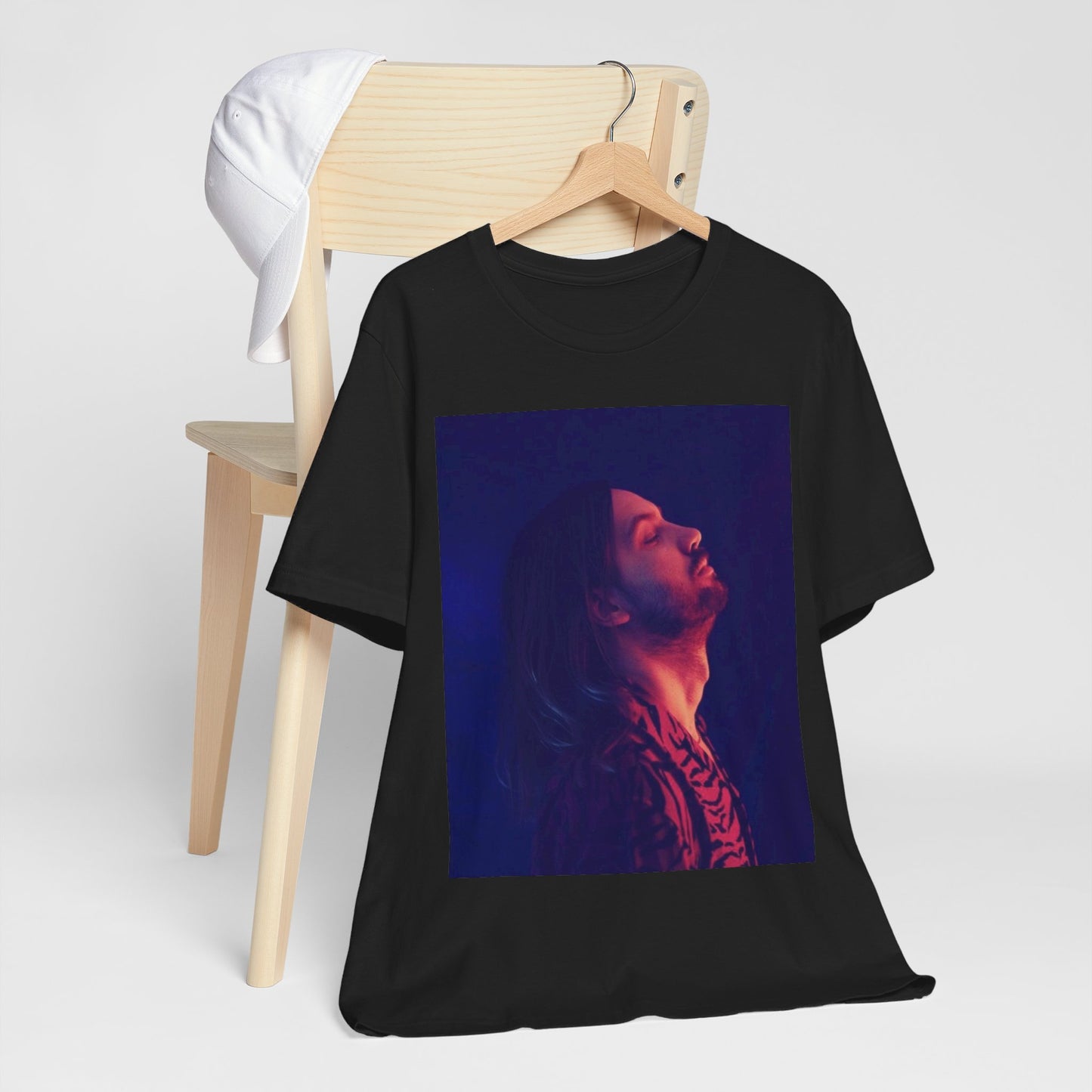 A black graphic t-shirt featuring a retro indie alt-rock graphic of Tame Impala.