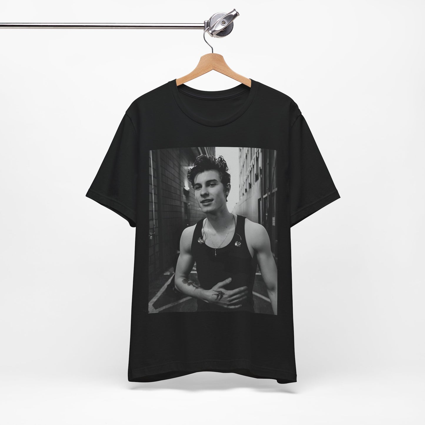 A black graphic t-shirt featuring a vintage black and white portrait graphic or photo of Shawn Mendes.