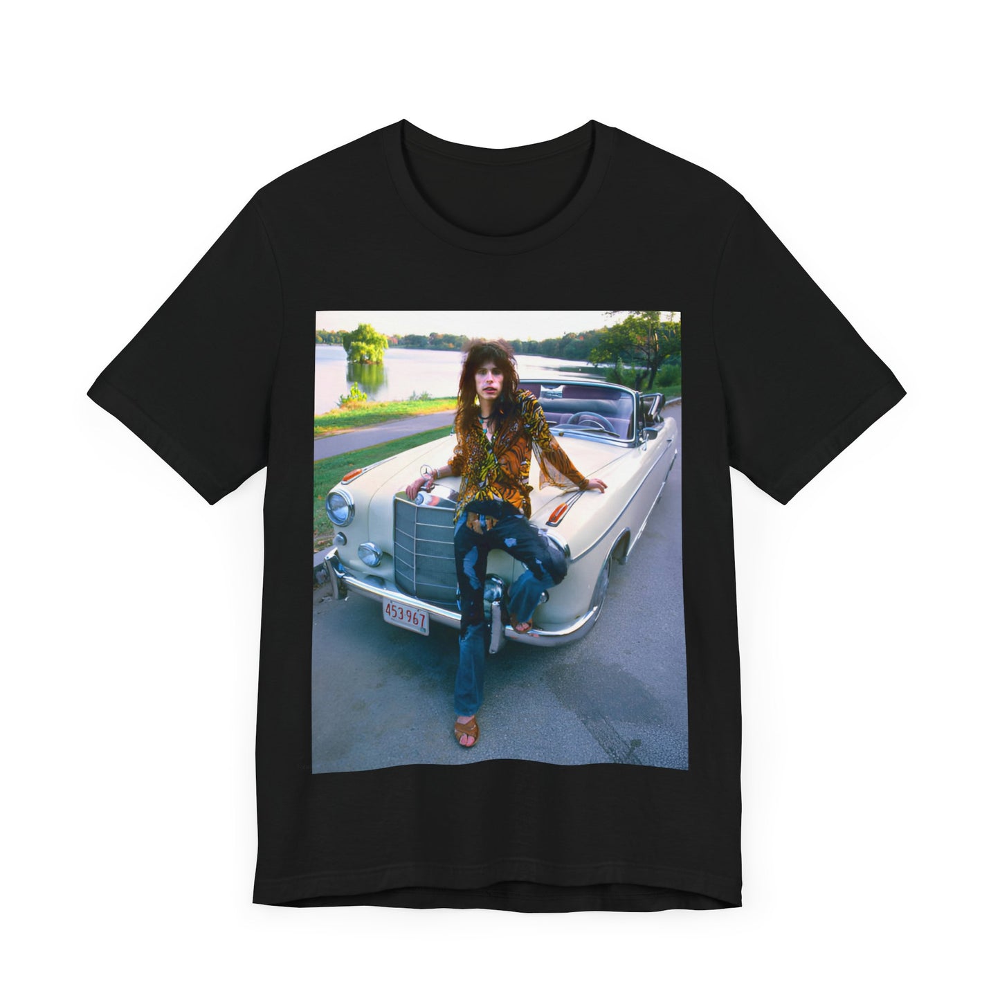 A black graphic t-shirt featuring a retro 70s photo of Aerosmith band members in a bohemian style, posing with a classic Mercedes car.