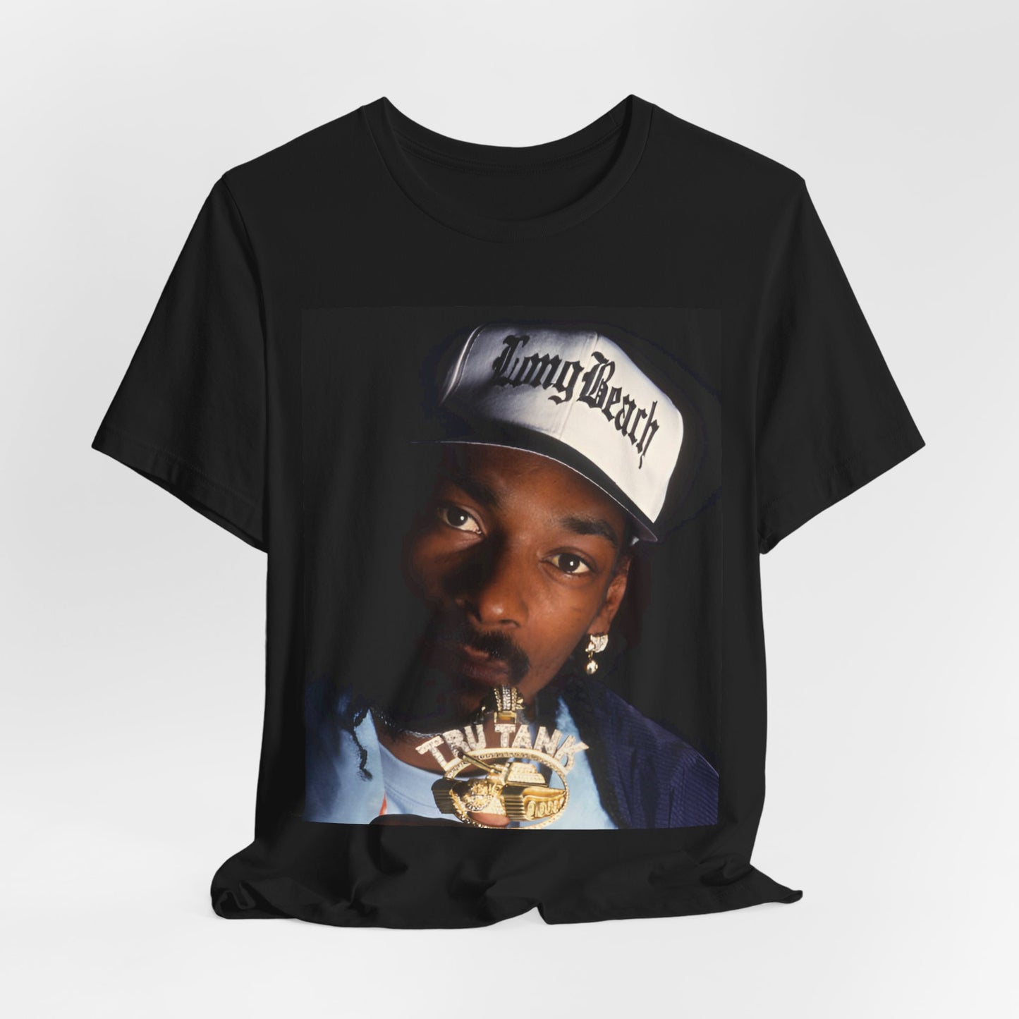 A black graphic t-shirt featuring a graphic of Snoop Dogg as a powerhouse OG rapper.
