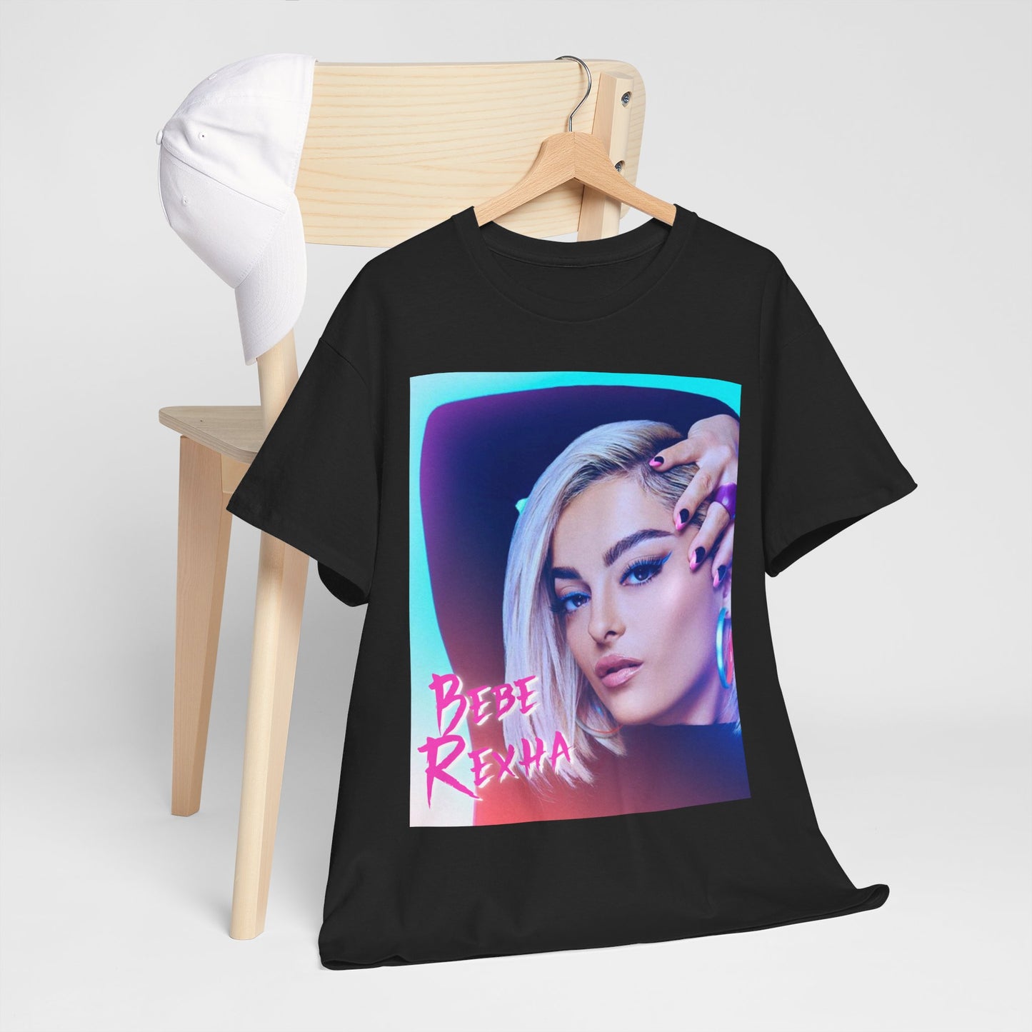 A black graphic t-shirt featuring a stylized graphic of Bebe Rexha, emphasizing her pop star persona.