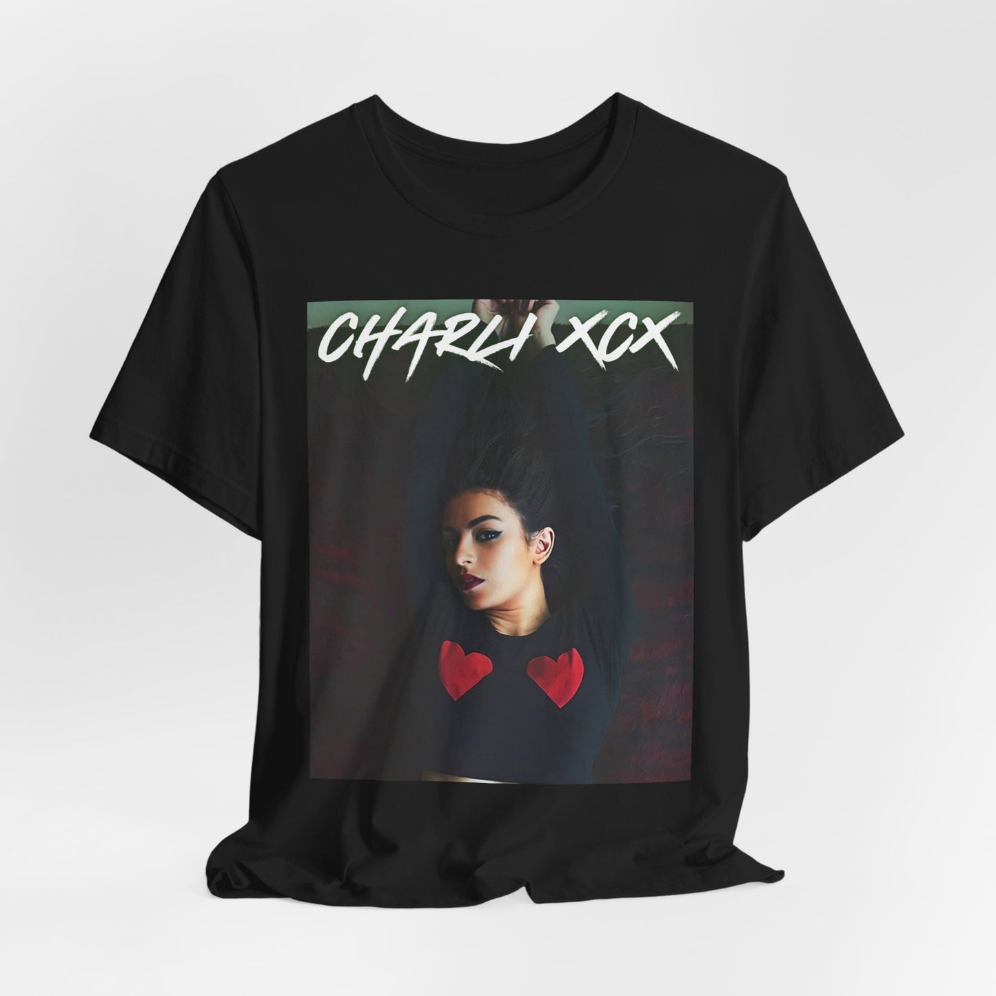 A black graphic t-shirt featuring a graphic of Charli XCX, designed with a future pop diva aesthetic.