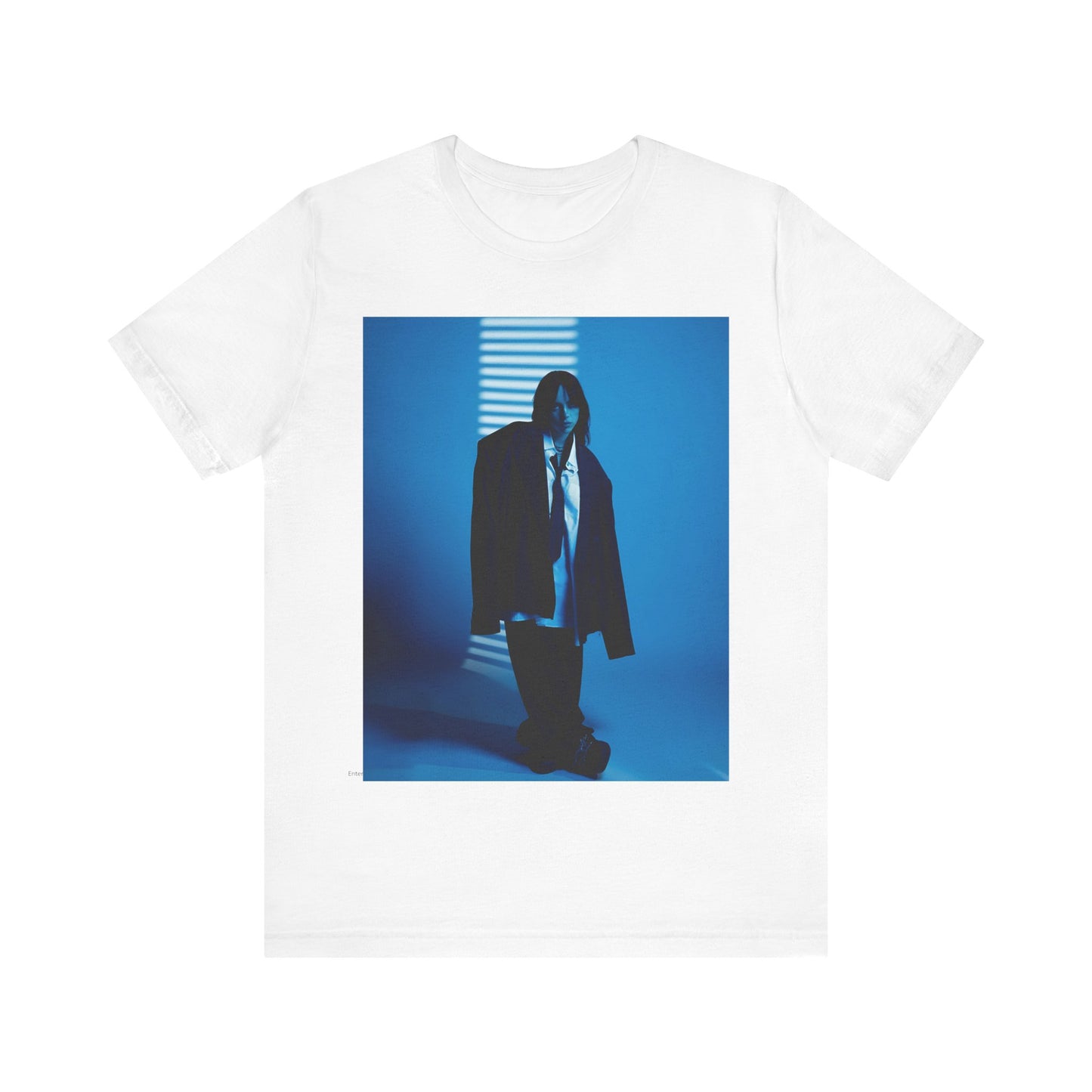 A high-fashion, editorial-style photo of Billie Eilish, embodying a 'breaking the rules' attitude, printed on a graphic t-shirt.