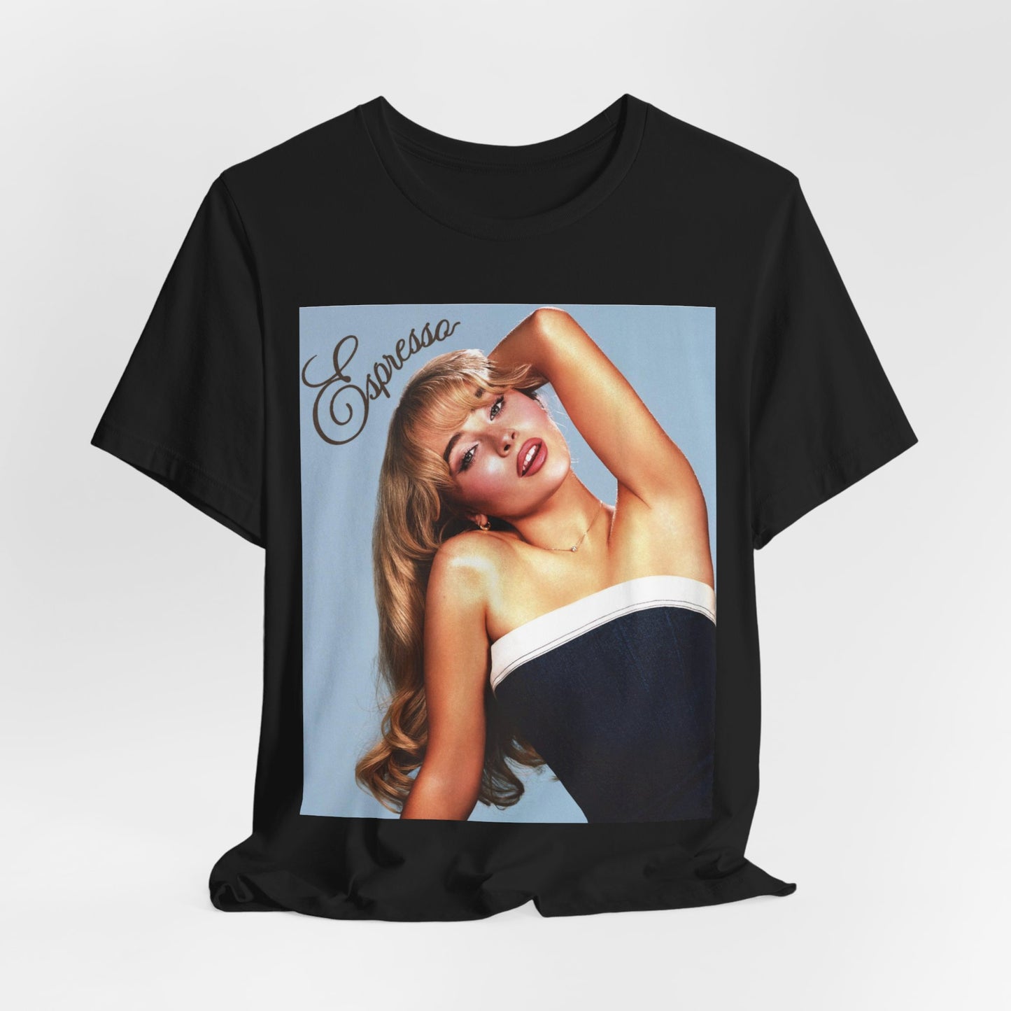 A black graphic t-shirt featuring a graphic related to Sabrina Carpenter's 'Espresso' song.