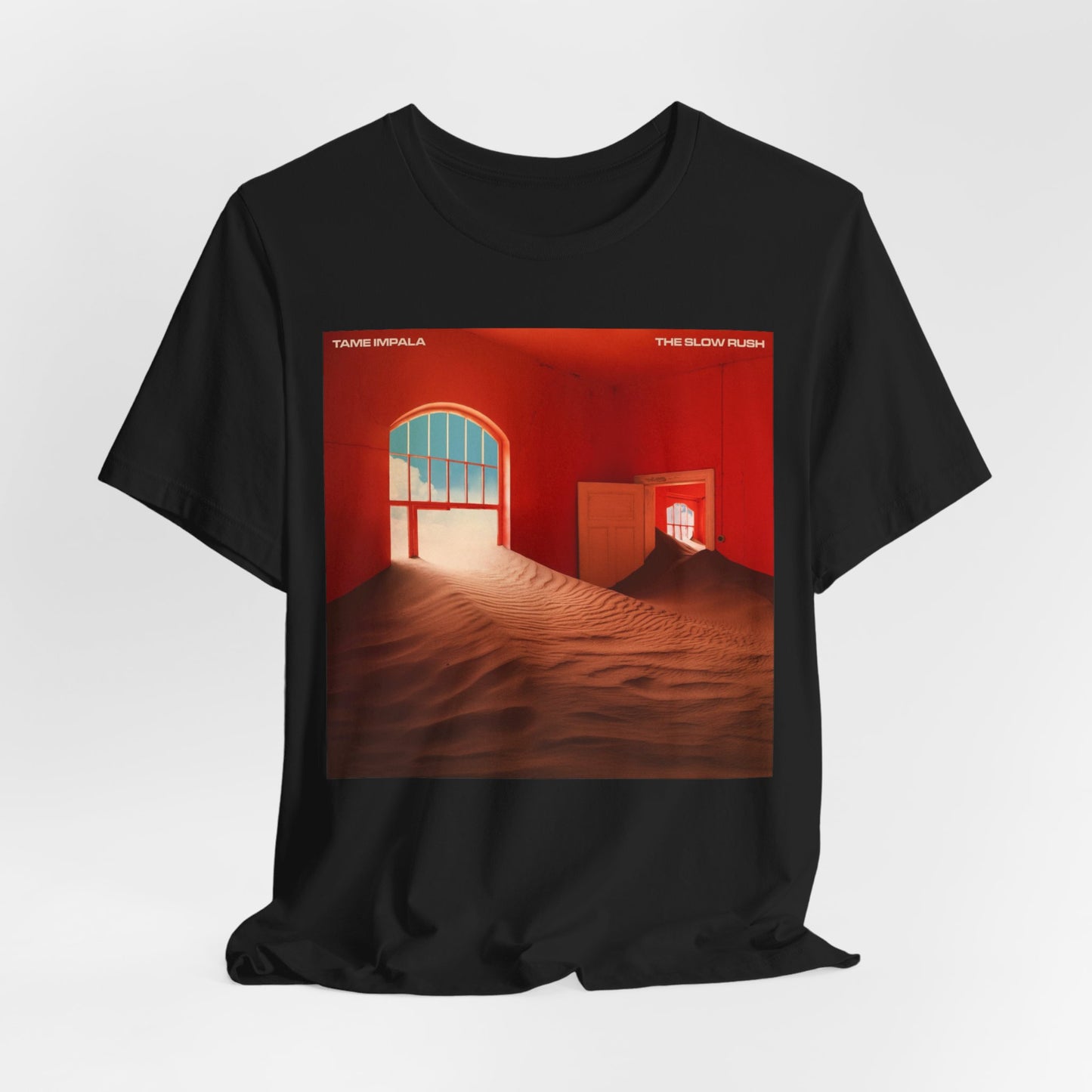 A black graphic t-shirt featuring a graphic related to Tame Impala's 'The Slow Rush' album.