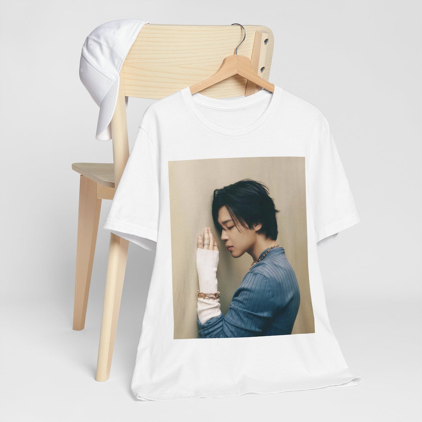 A black graphic t-shirt featuring a cool K-Pop idol essential graphic of Jimin.