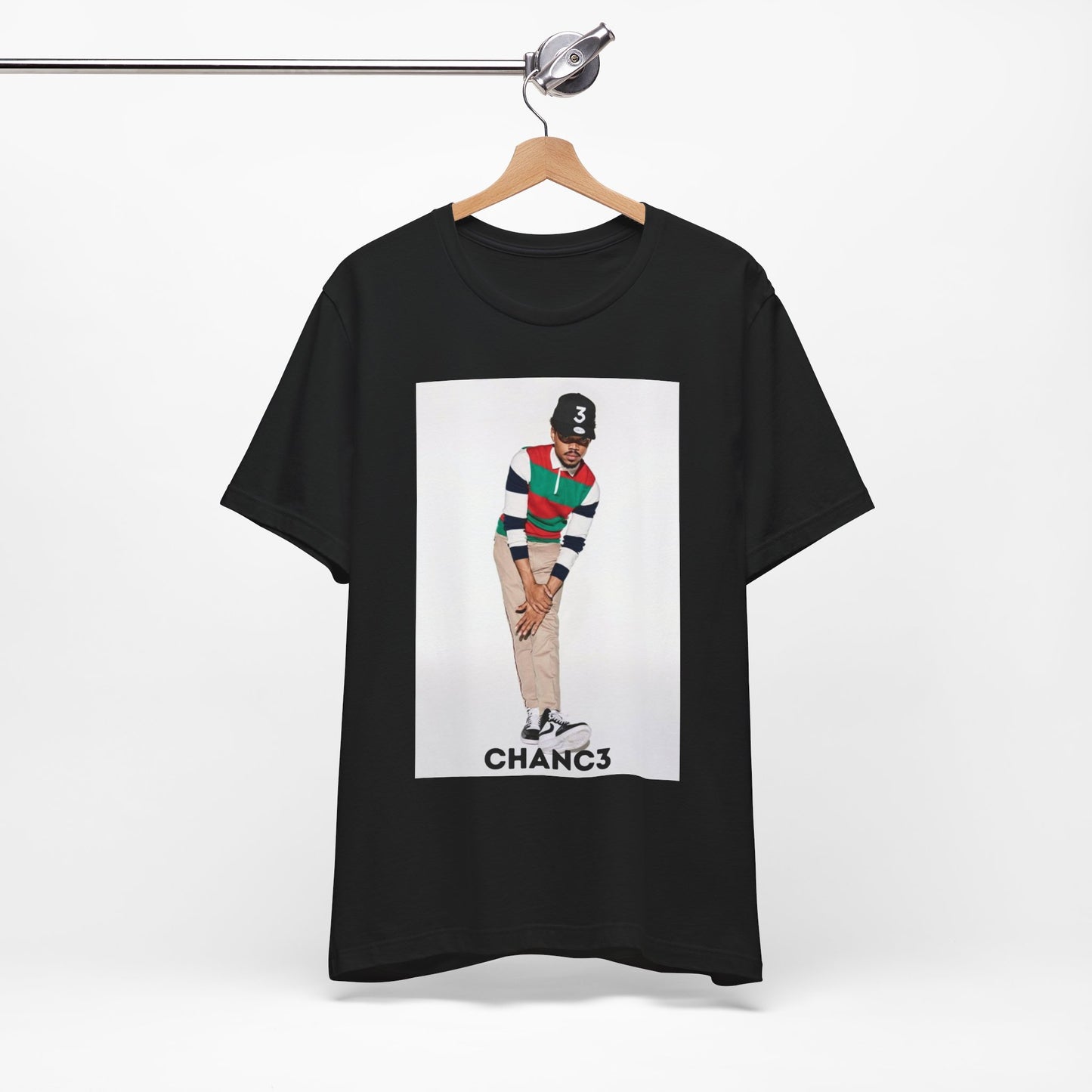 A black graphic t-shirt featuring a graphic of Chance the Rapper with a positive or 'feel good' hip hop vibe.
