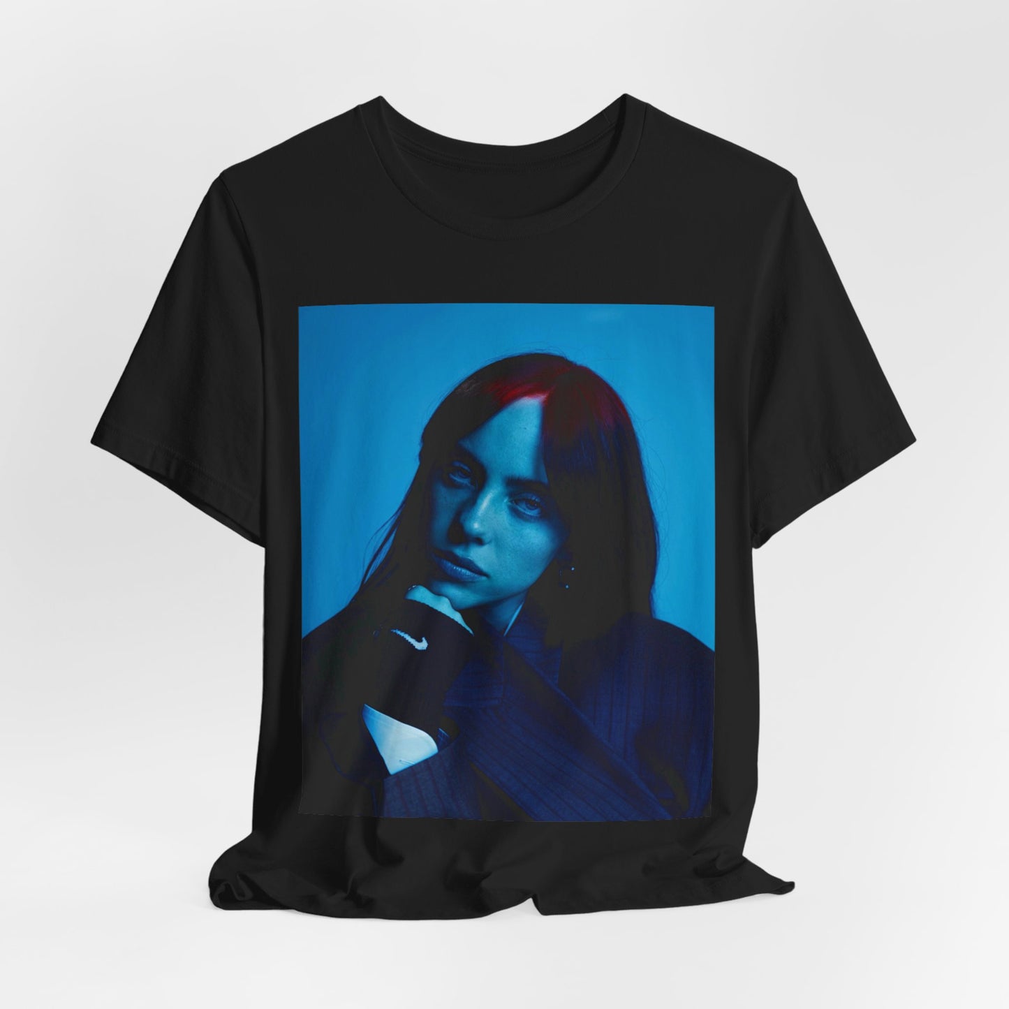 A soft, slightly blurred photo of Billie Eilish, evoking the dreamy and nostalgic feel of her song 'Ocean Eyes,' printed on a t-shirt.