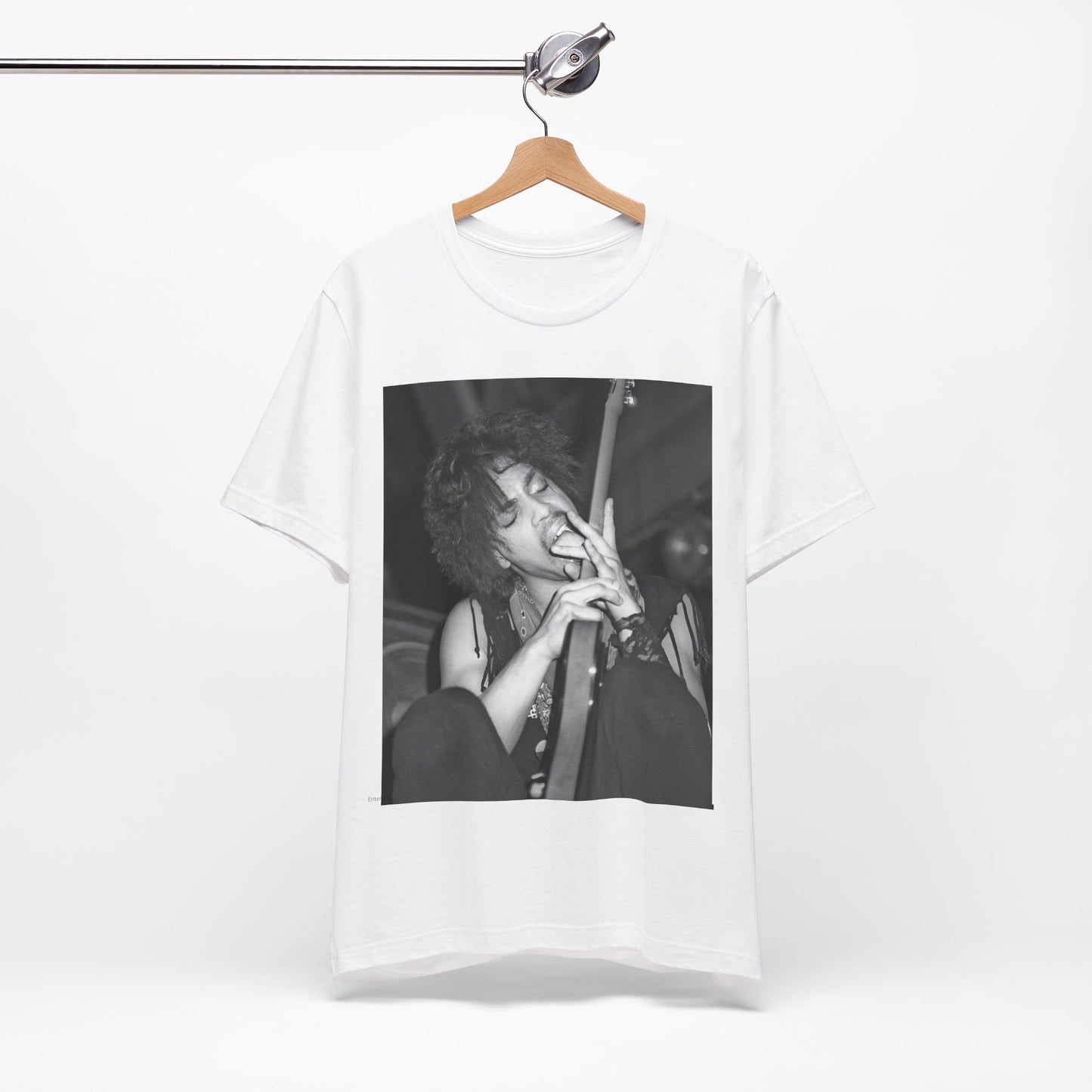 A black graphic t-shirt featuring a graphic or photo of Prince performing wildly on stage.
