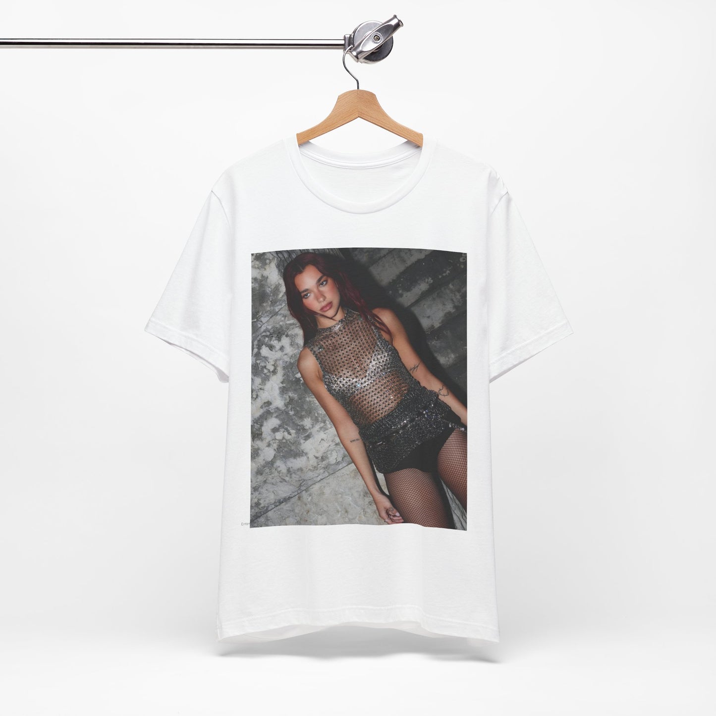 A black graphic t-shirt featuring a graphic of Dua Lipa as a disco queen, with an aesthetic design.